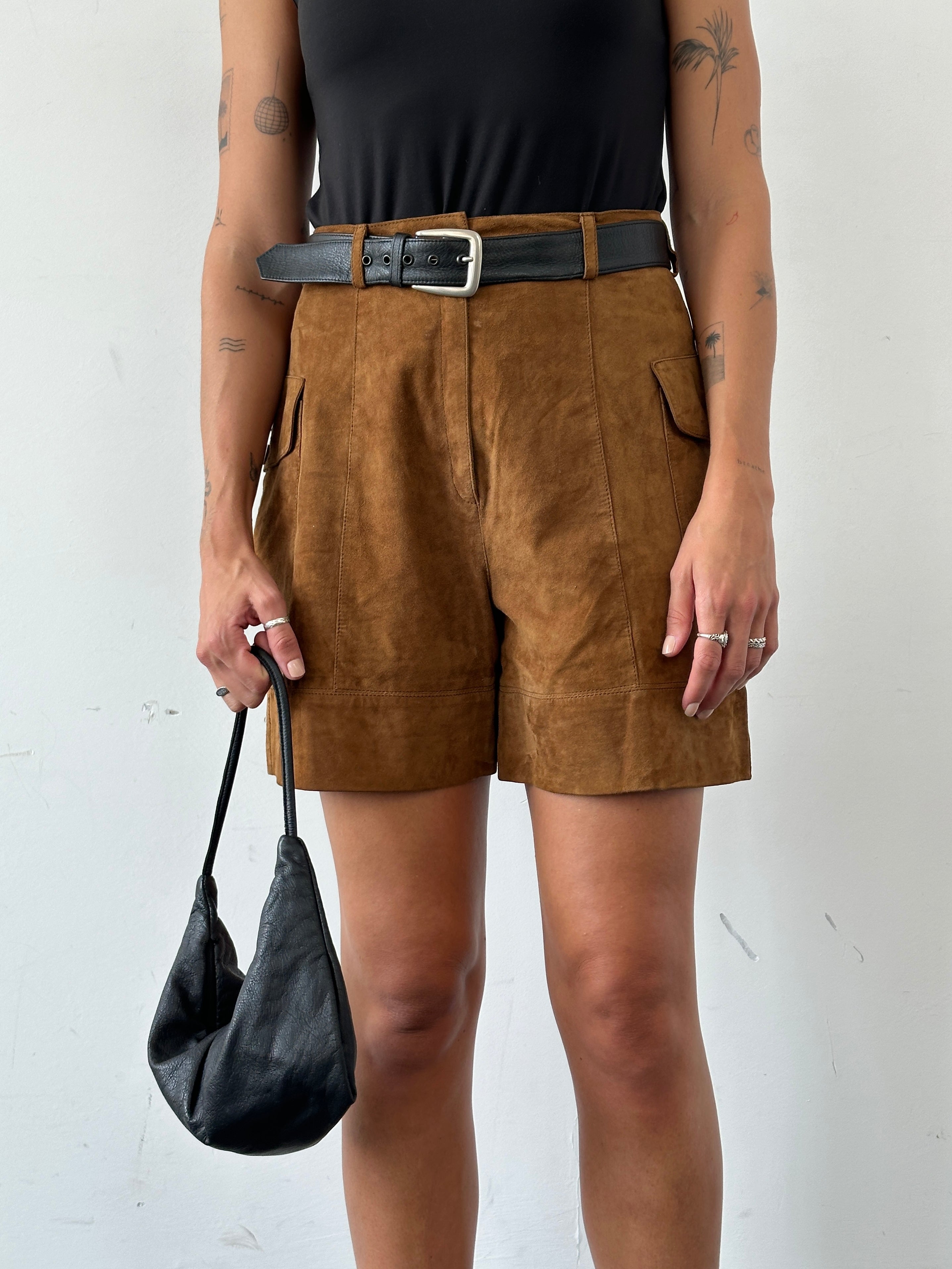 Vintage Italian high waisted suede leather shorts, size W27, featuring a stylish vintage design and classic high-rise fit.