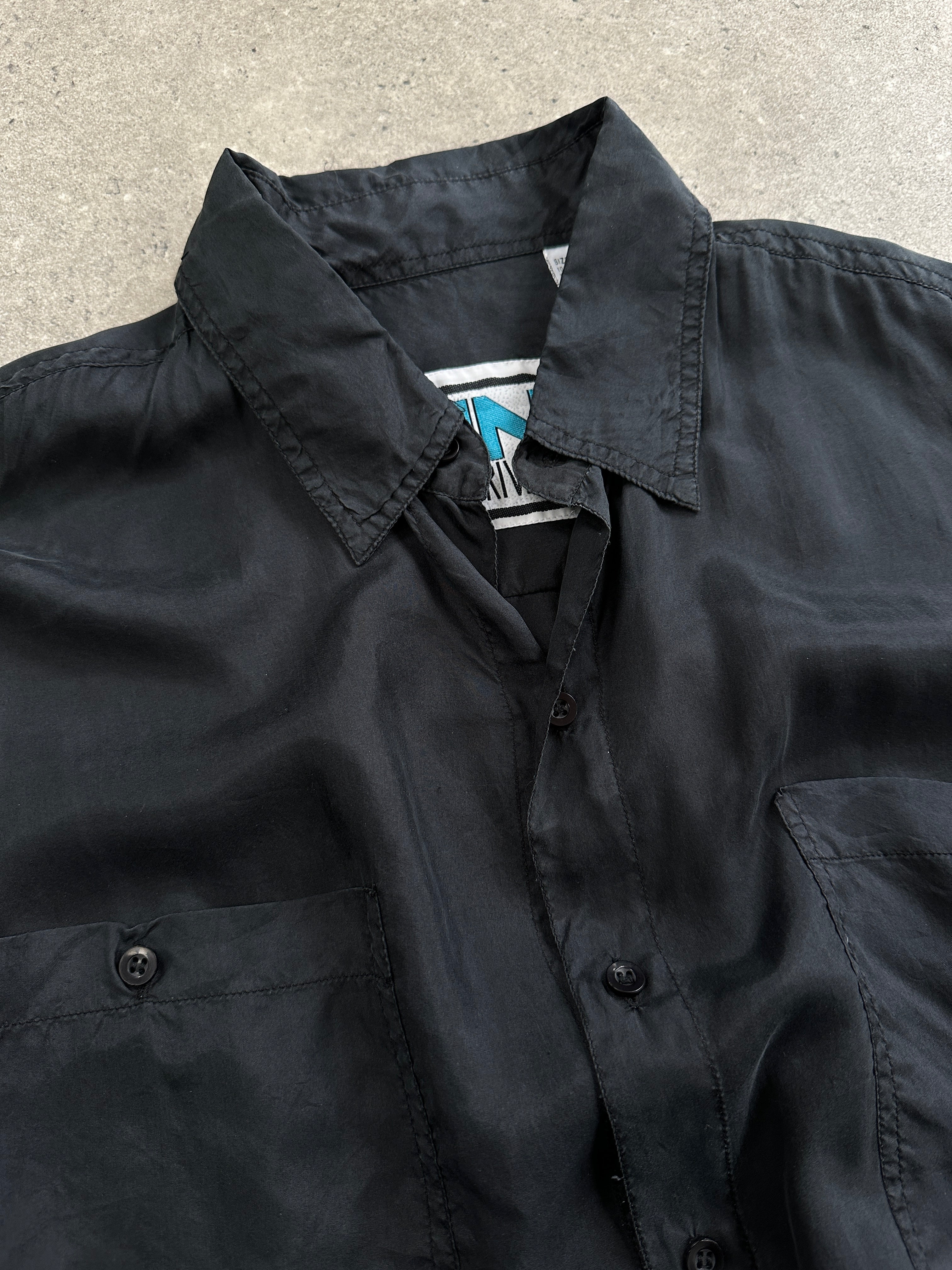 Vintage pure silk short sleeve shirt in size L/XL, featuring a smooth, shiny fabric and classic collar design.