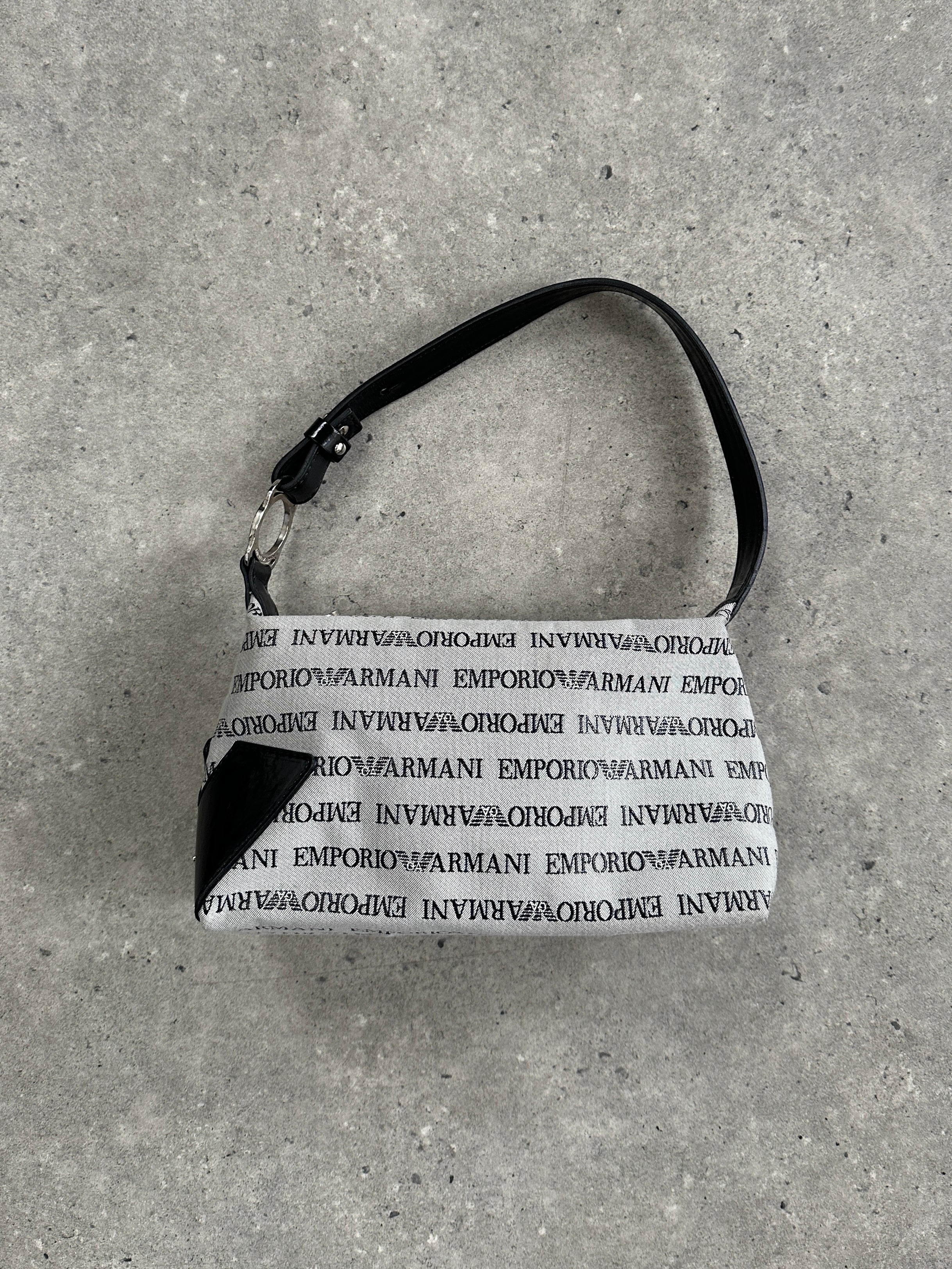 Emporio Armani Monogram shoulder bag featuring a sleek design with signature logo pattern and adjustable strap.