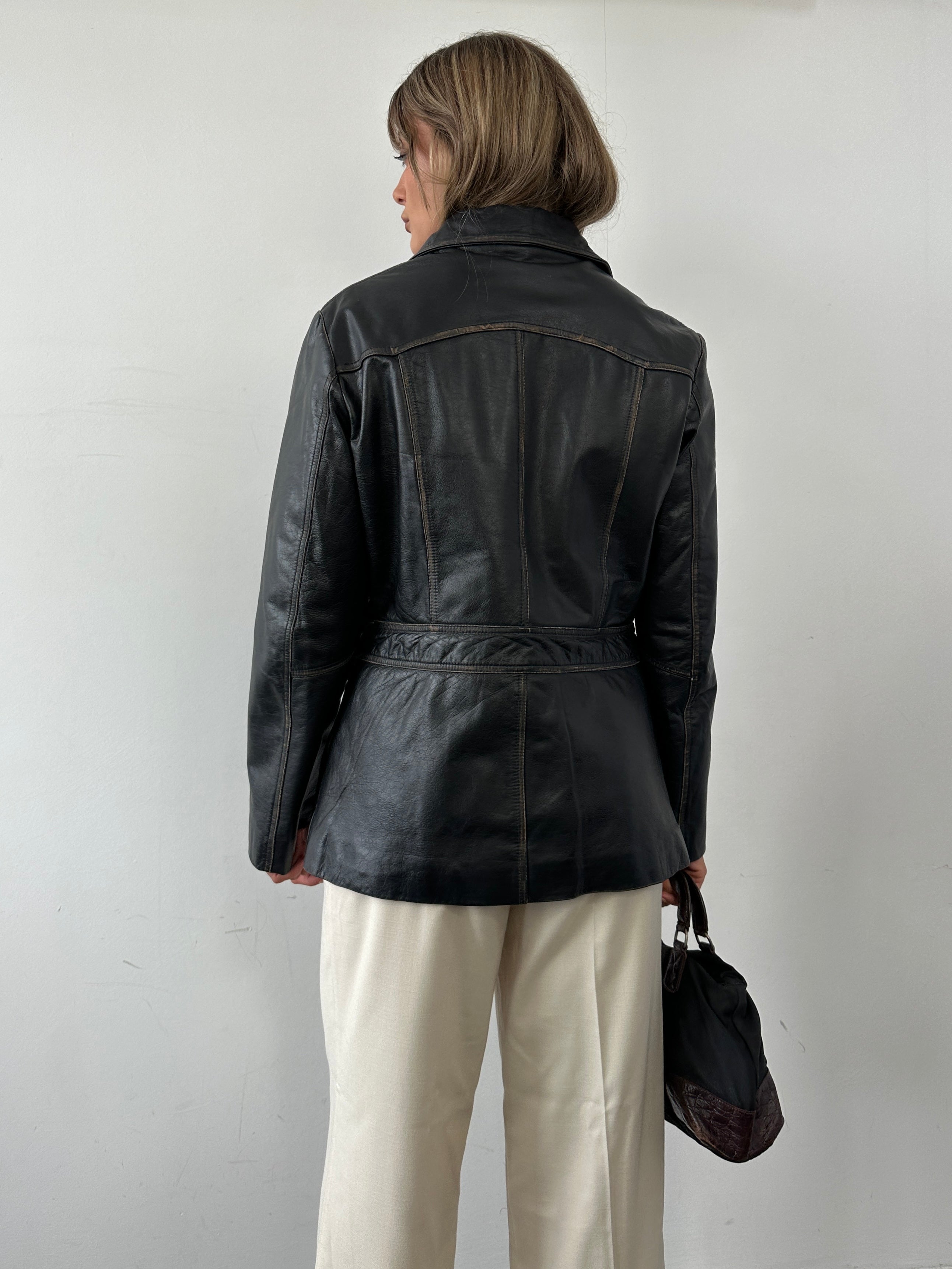 Conbipel double zip waist leather jacket in black, featuring a fitted design and double zipper front closure.