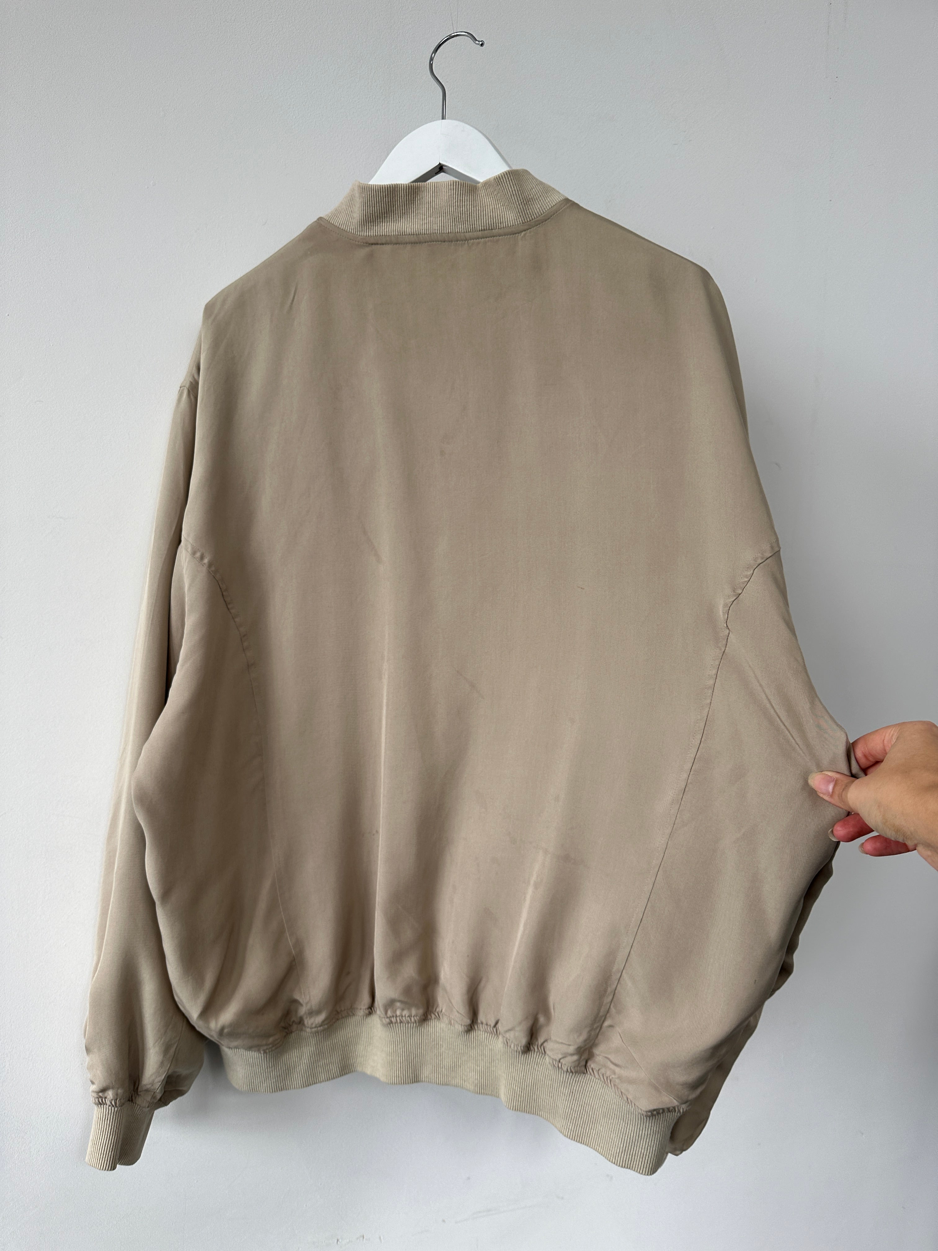 Vintage pure silk bomber jacket in XL, showcasing a classic design with smooth silk fabric and ribbed collar and cuffs.