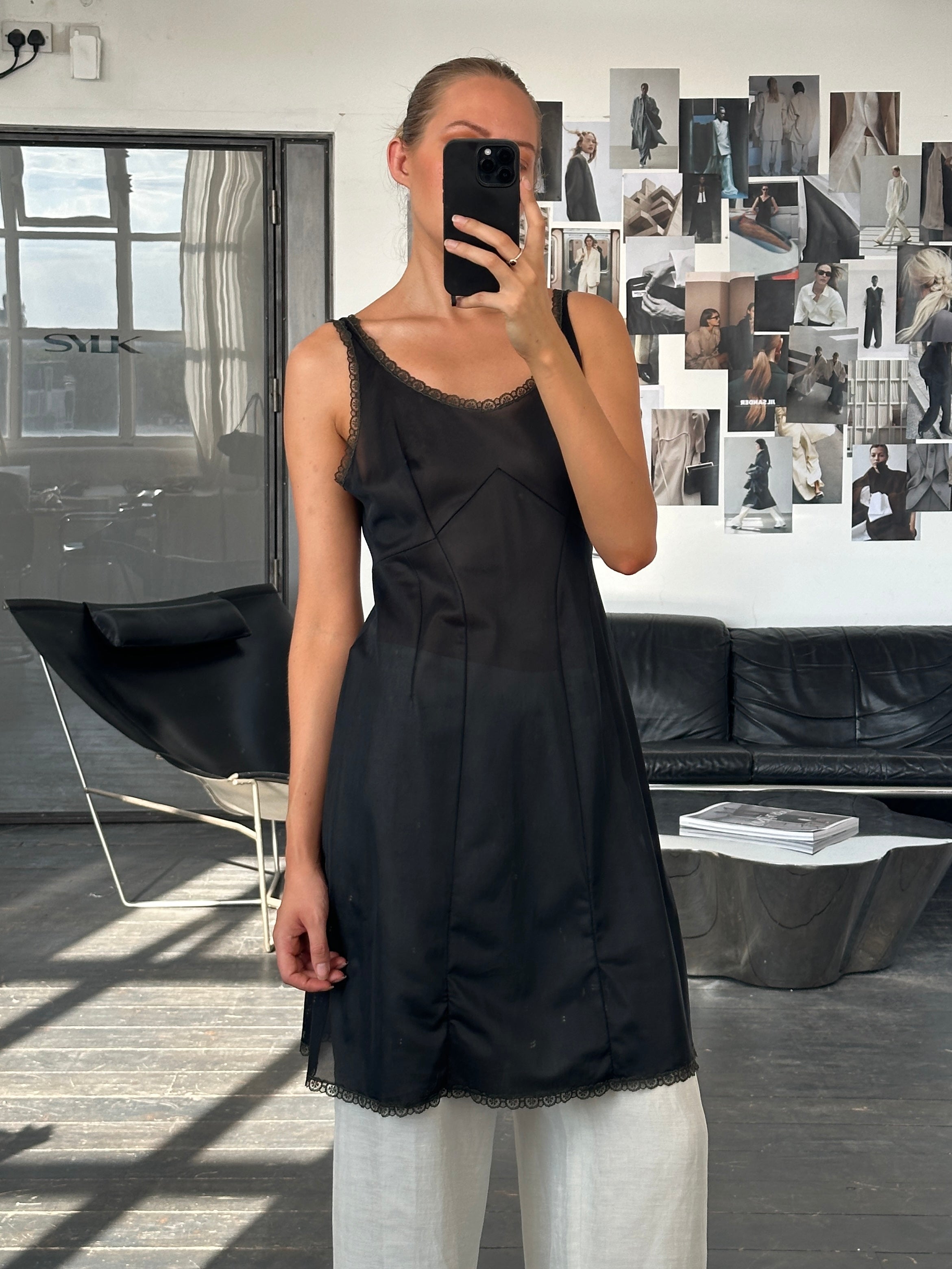 Vintage 1990s lace mini slip dress in size M, featuring delicate lace fabric and a classic vintage style.