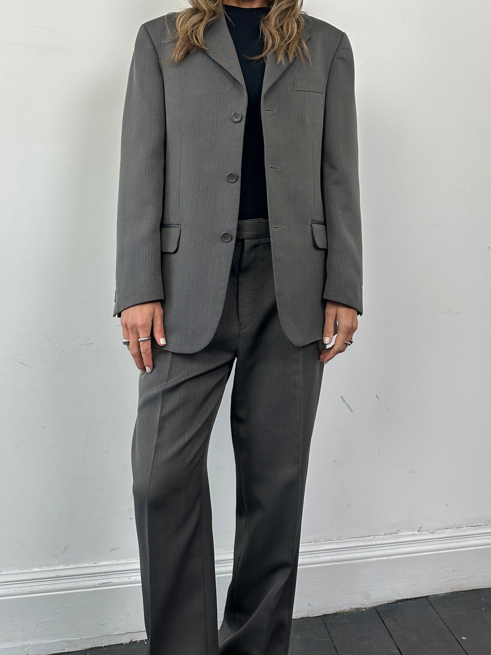 Vintage herringbone single-breasted suit jumpsuit in size 38R/W32, featuring classic tailored design and vintage fabric.