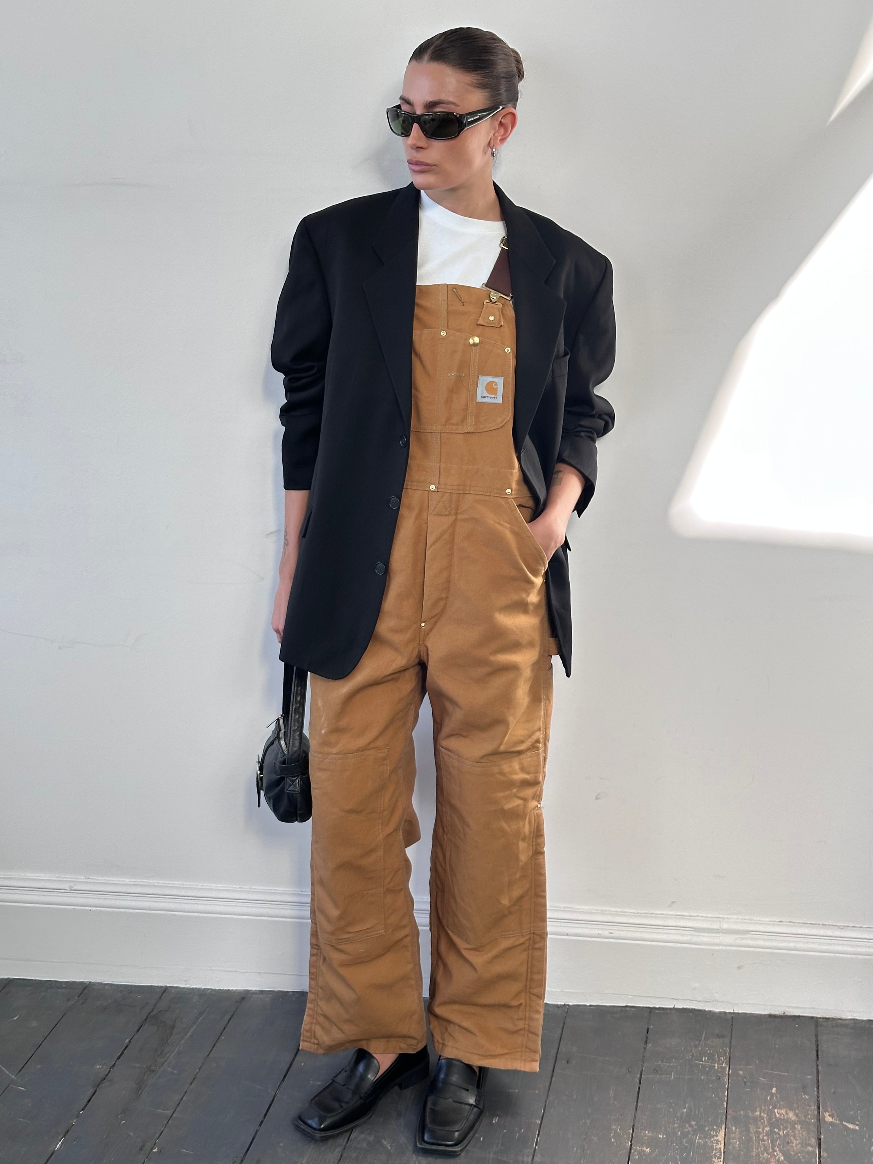 Carhartt pure cotton dungarees in size M, featuring durable fabric, adjustable straps, and classic workwear design.