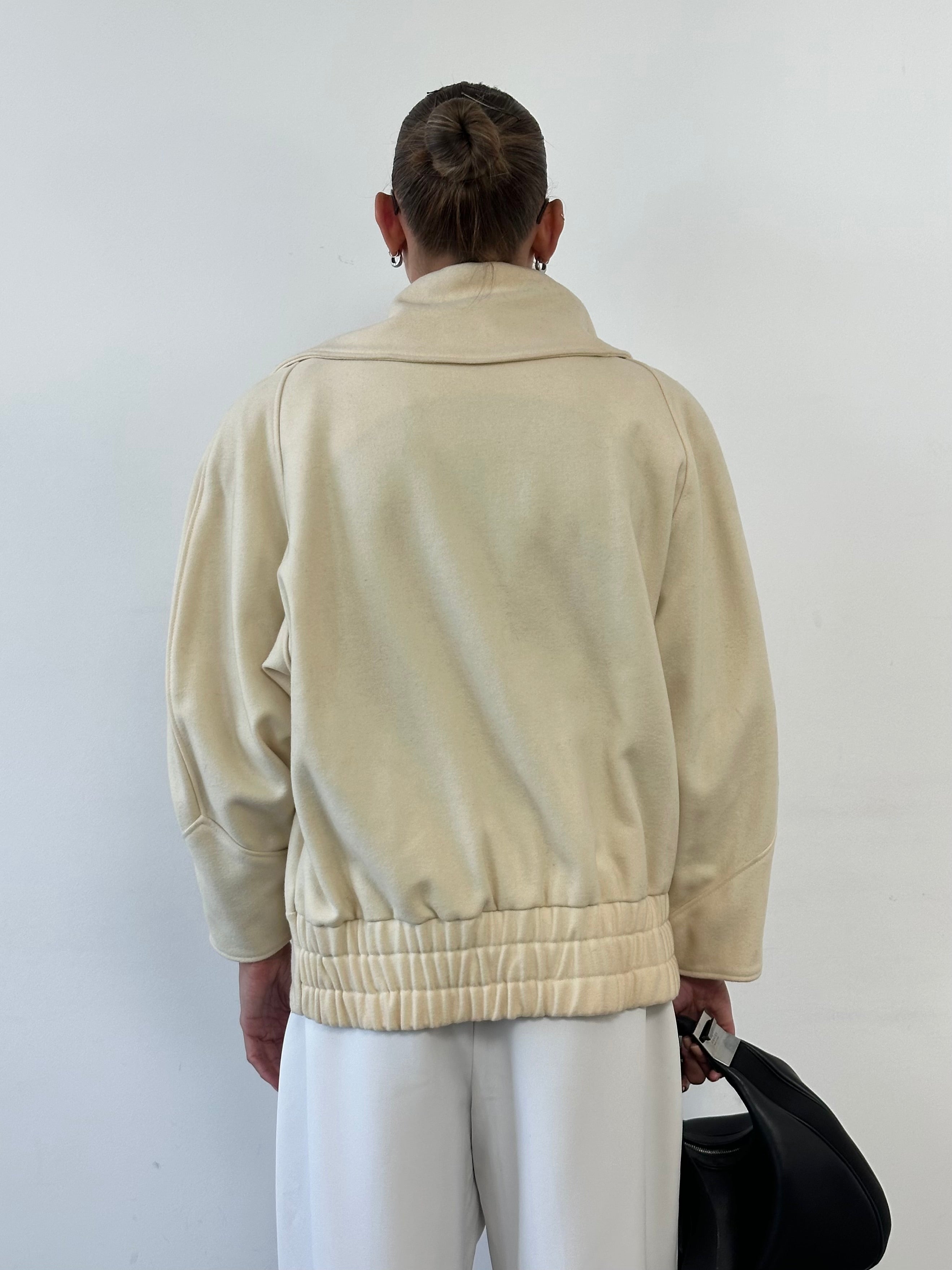 Vintage asymmetric wool bomber jacket with funnel neck in neutral tones, showcasing its stylish, vintage design and tailored fit.