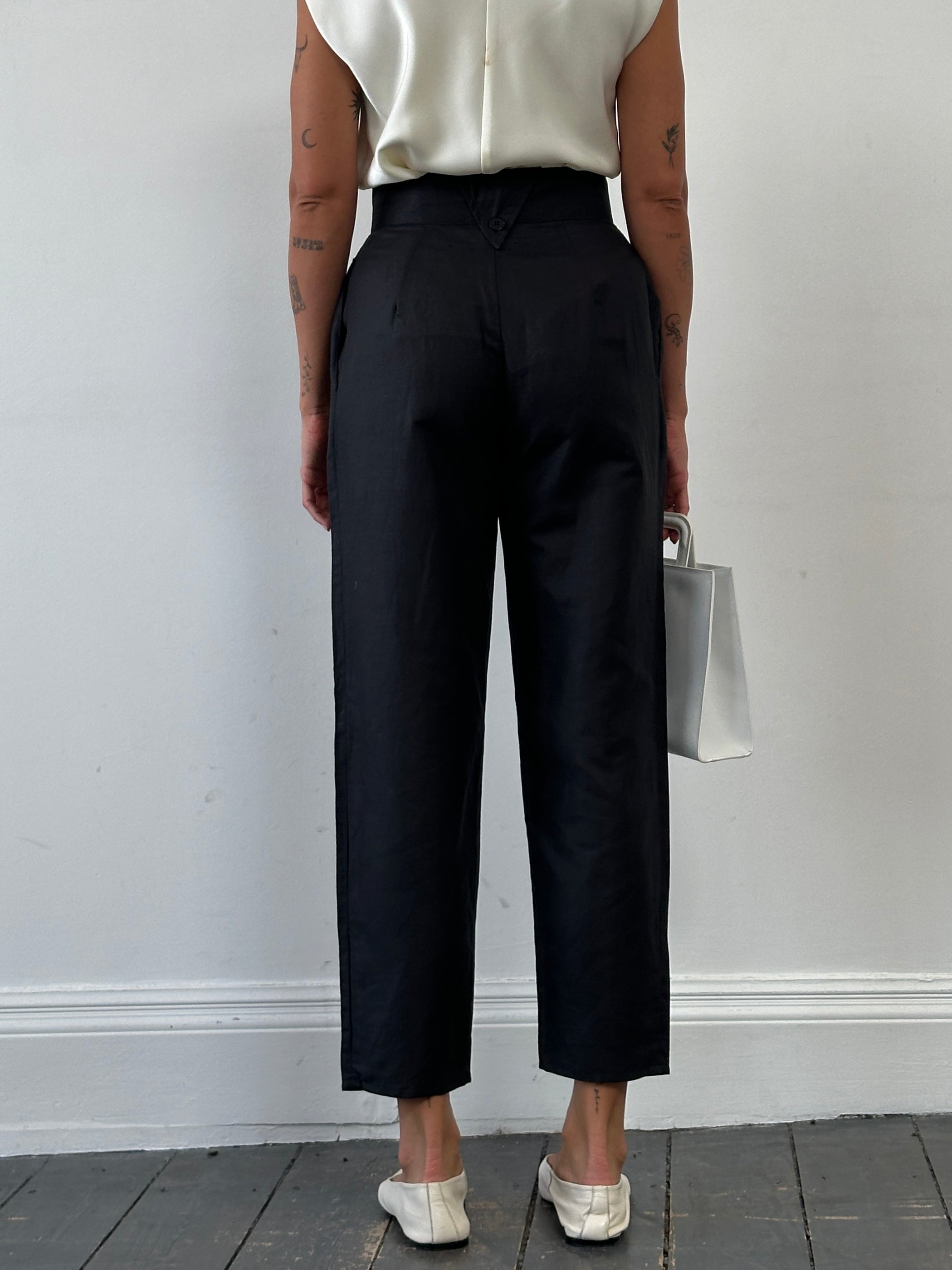 Vintage high waisted tapered trousers with a classic fit, shown in a rich fabric with front and back view, size W26.