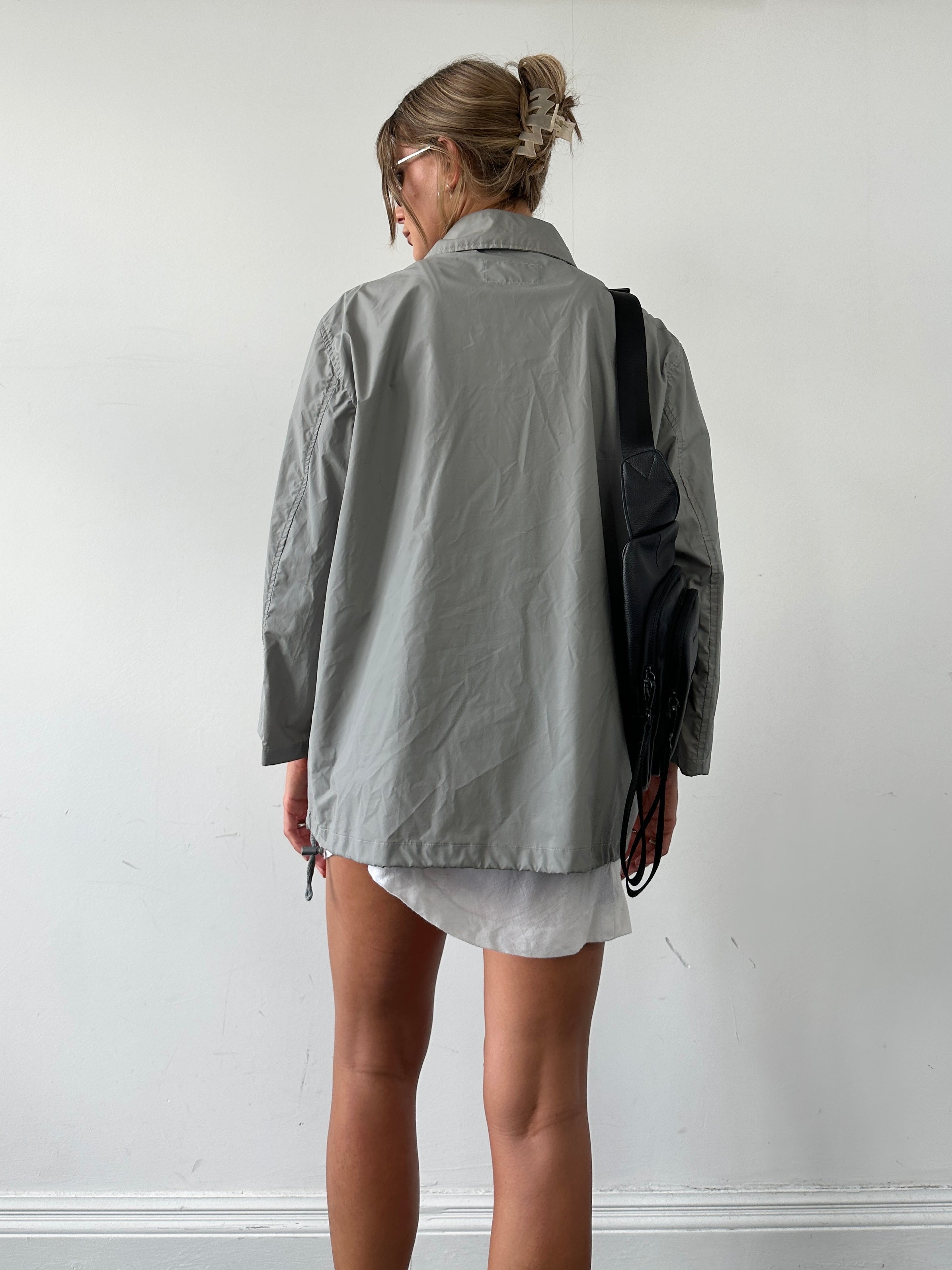 Valentino Sport raincoat jacket in size L, lightweight waterproof jacket with sporty design and Valentino branding.