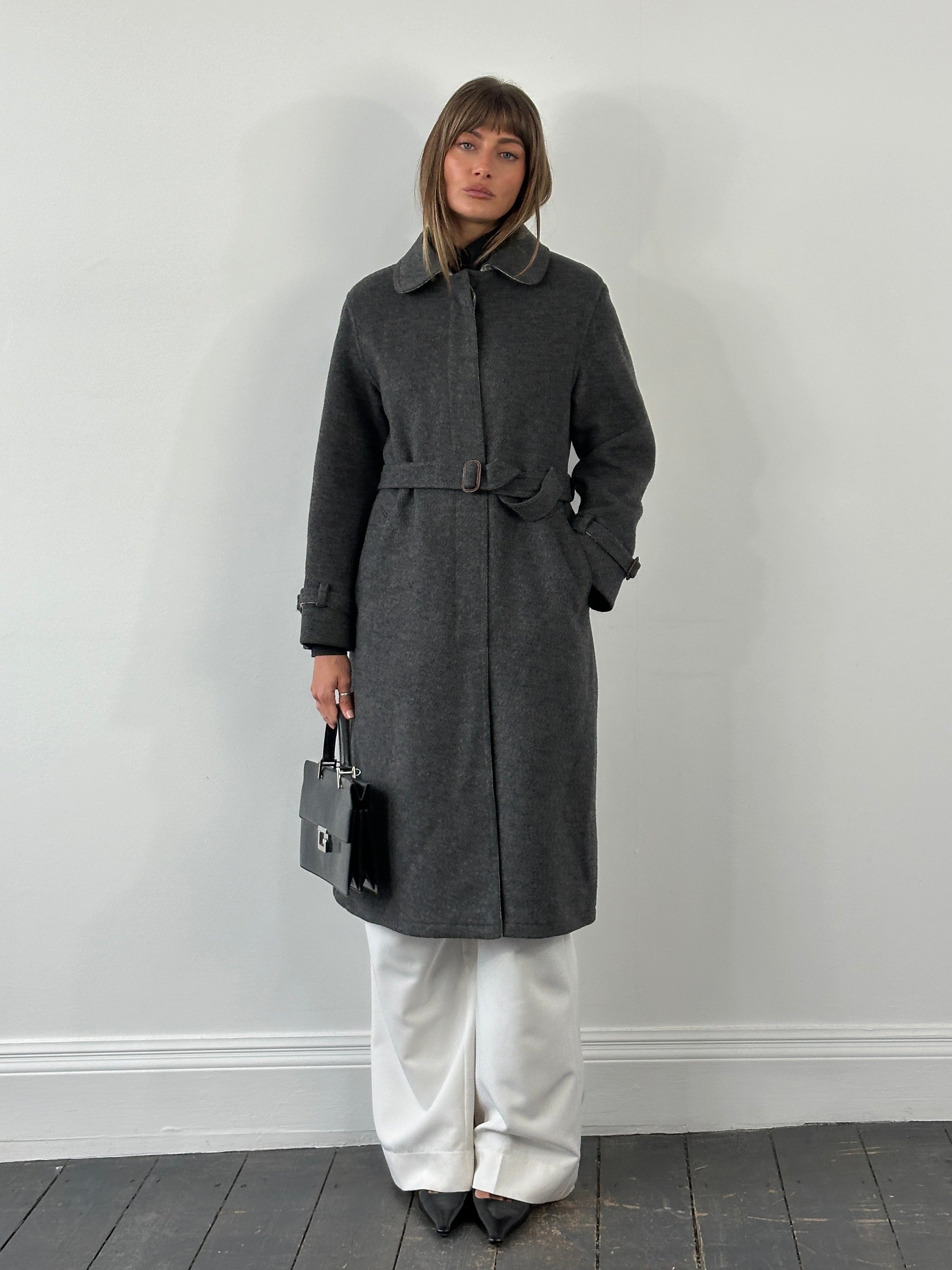 Vintage 1980s wool belted coat with concealed placket, in size S/M, featuring classic tailored style and textured fabric.
