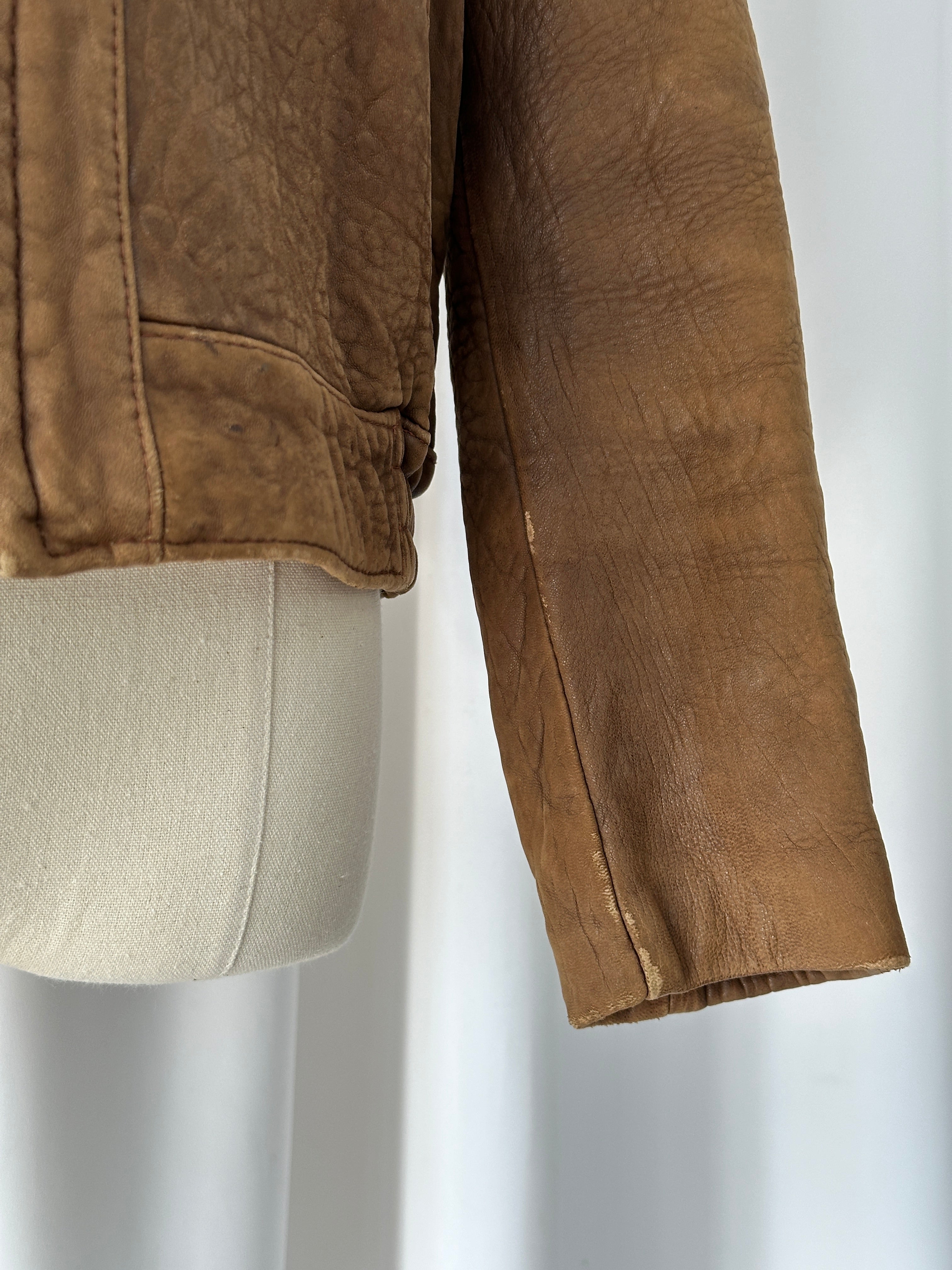 Vintage USA 1980s leather bomber jacket in XS/S size, classic black leather with ribbed cuffs and collar.