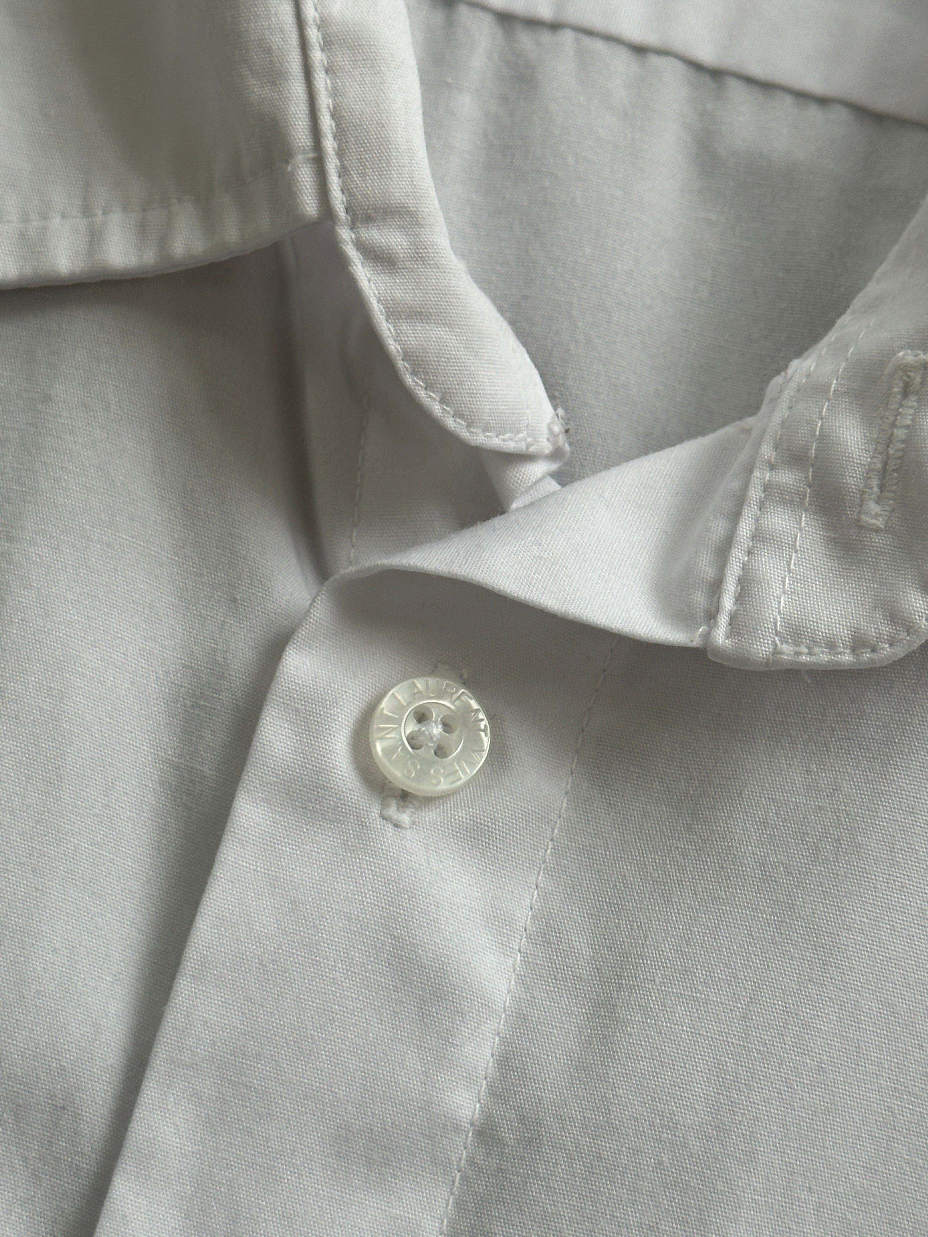 Yves Saint Laurent Pour Homme cotton short sleeve logo shirt in size L, featuring a classic fit with the brand's logo on the chest.