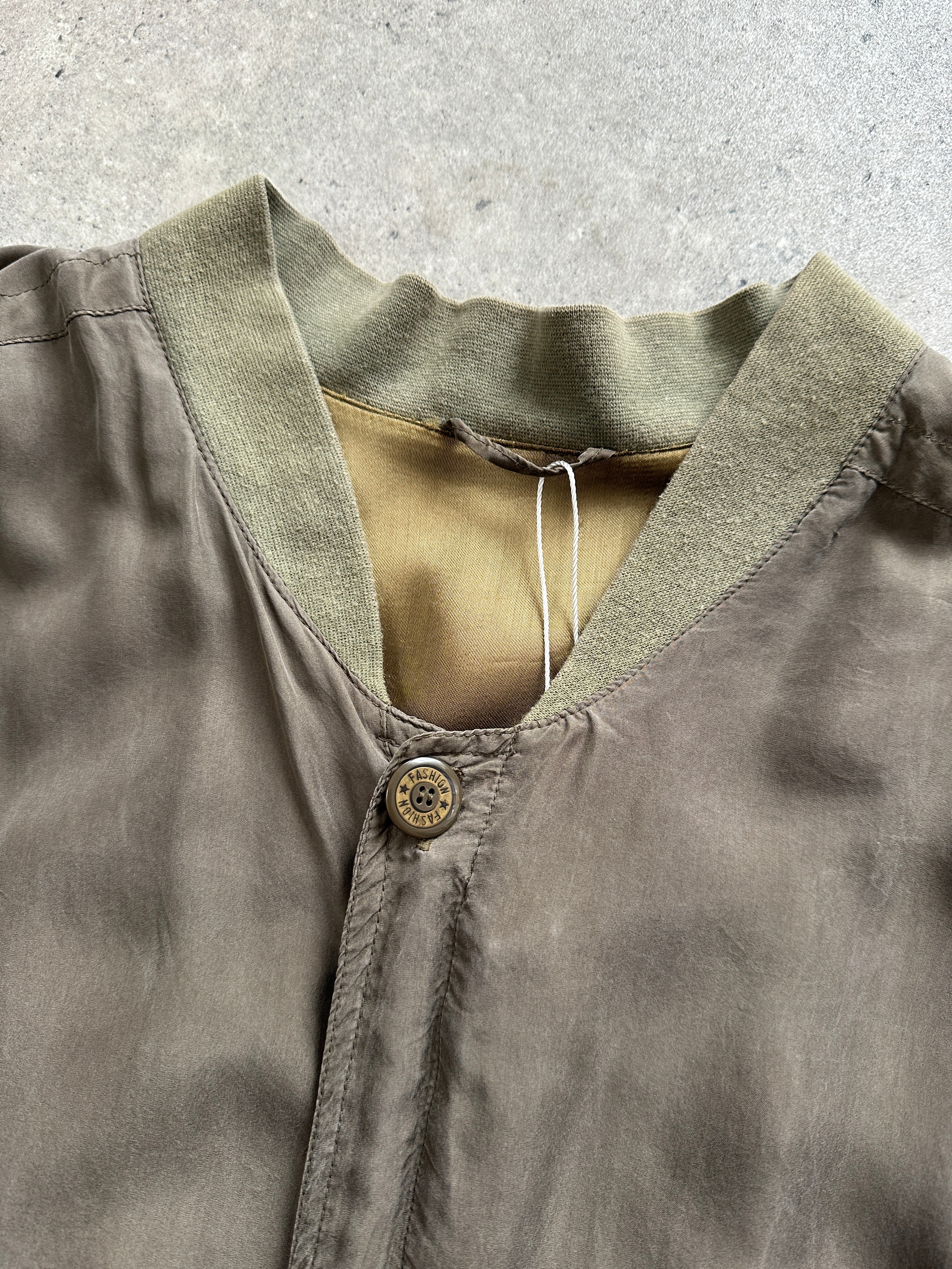 Pierre Cardin XXL pure silk slouchy bomber jacket displayed on a hanger, showcasing its smooth fabric and relaxed fit.