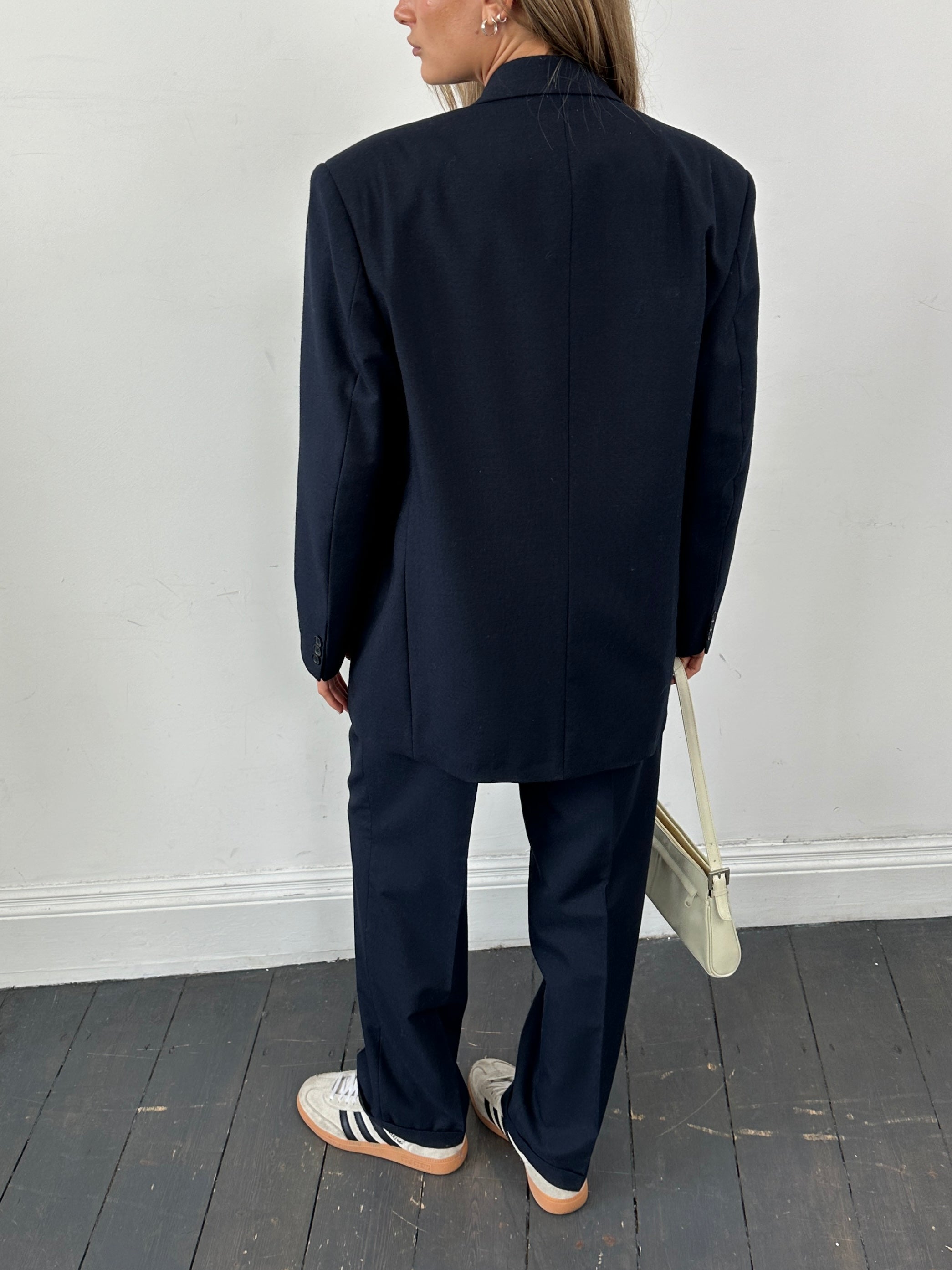 Vintage wool blend single-breasted three-piece suit, size 38R/W30, featuring classic design and tailored fit, displayed on a mannequin.
