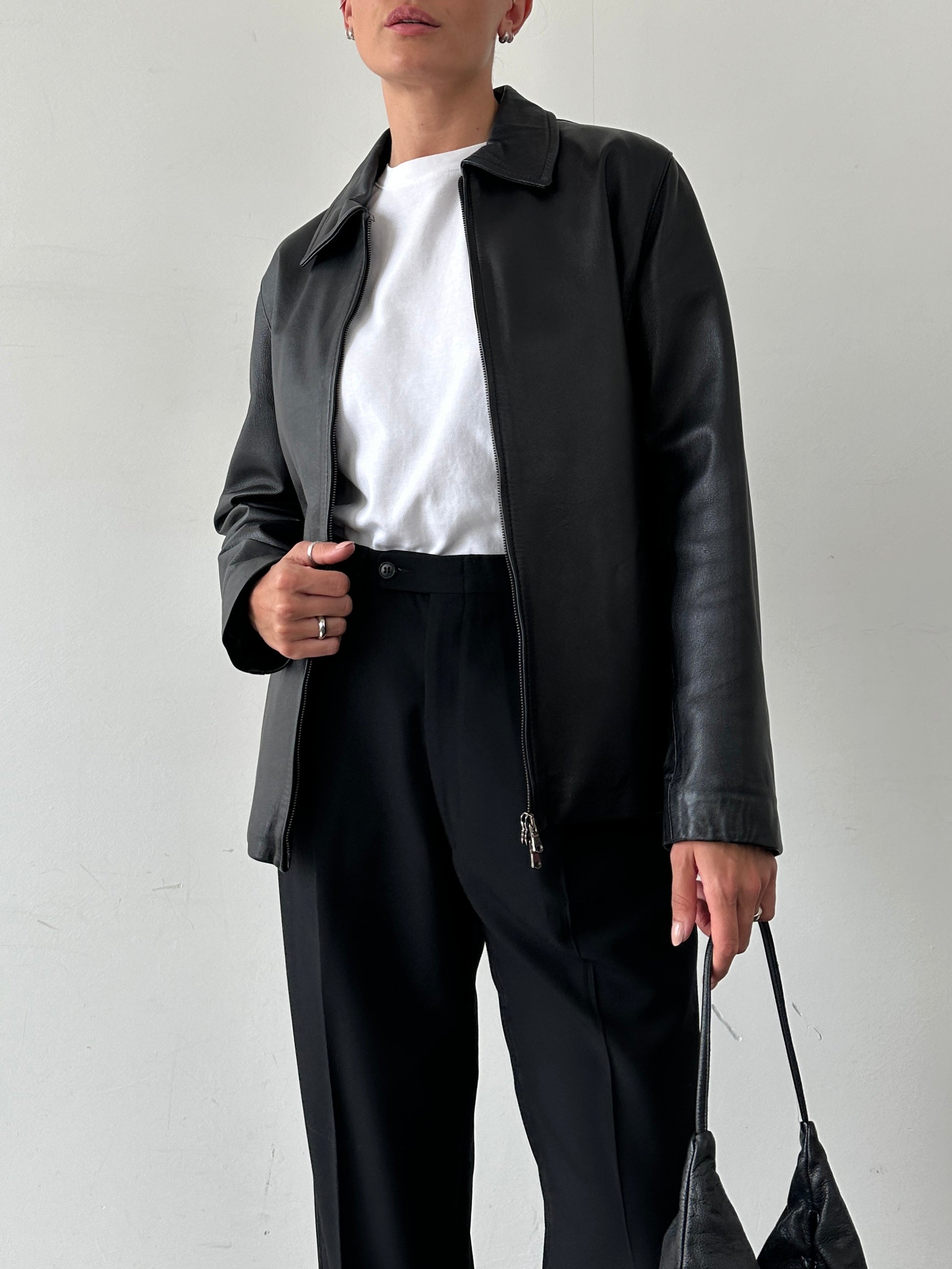 Vintage Italian vintage smooth leather double zip jacket in size M, showing its classic design and high-quality craftsmanship.