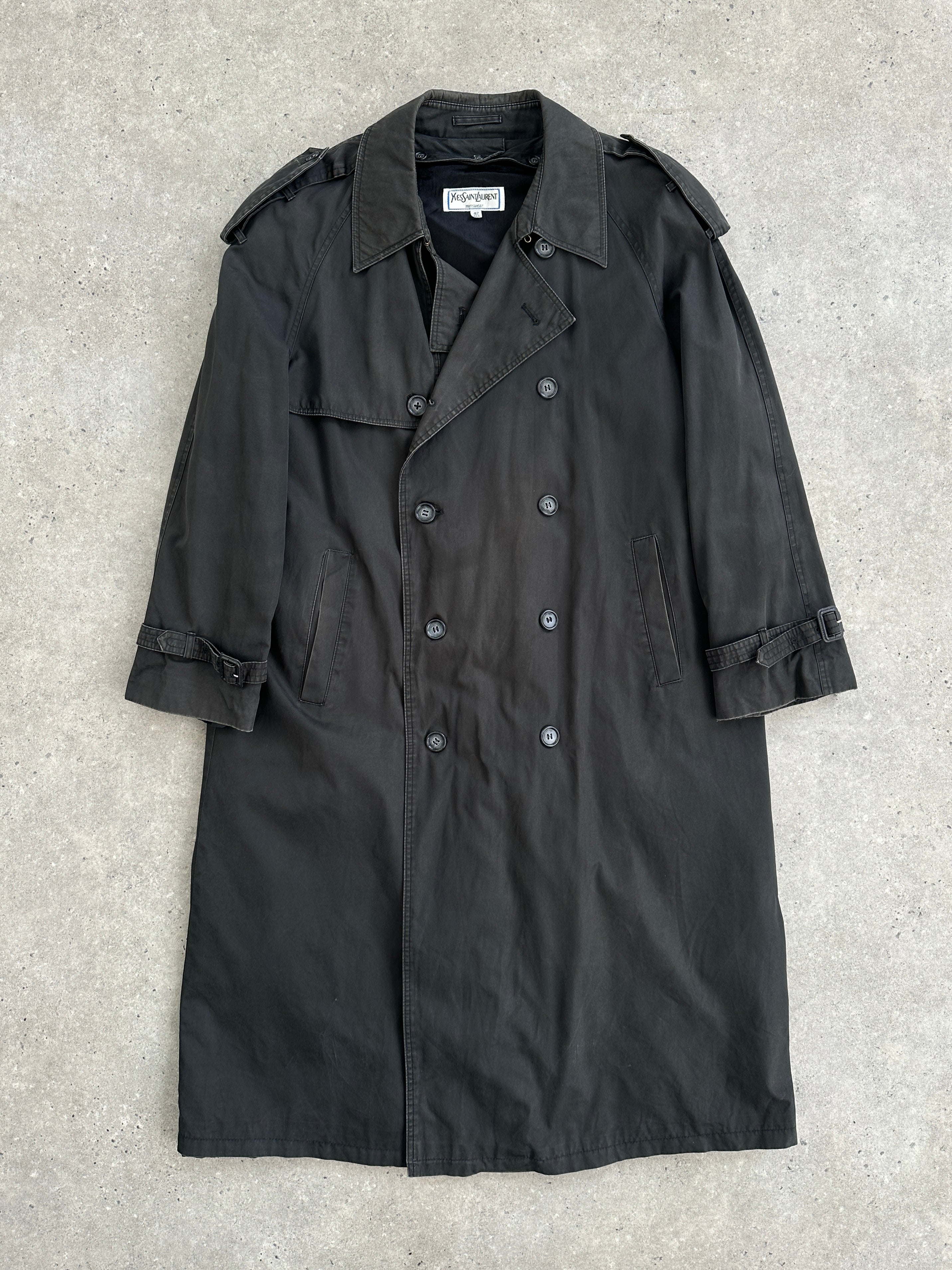Yves Saint Laurent XL cotton double-breasted belted coat hanging on a hanger showing front view and classic design details.