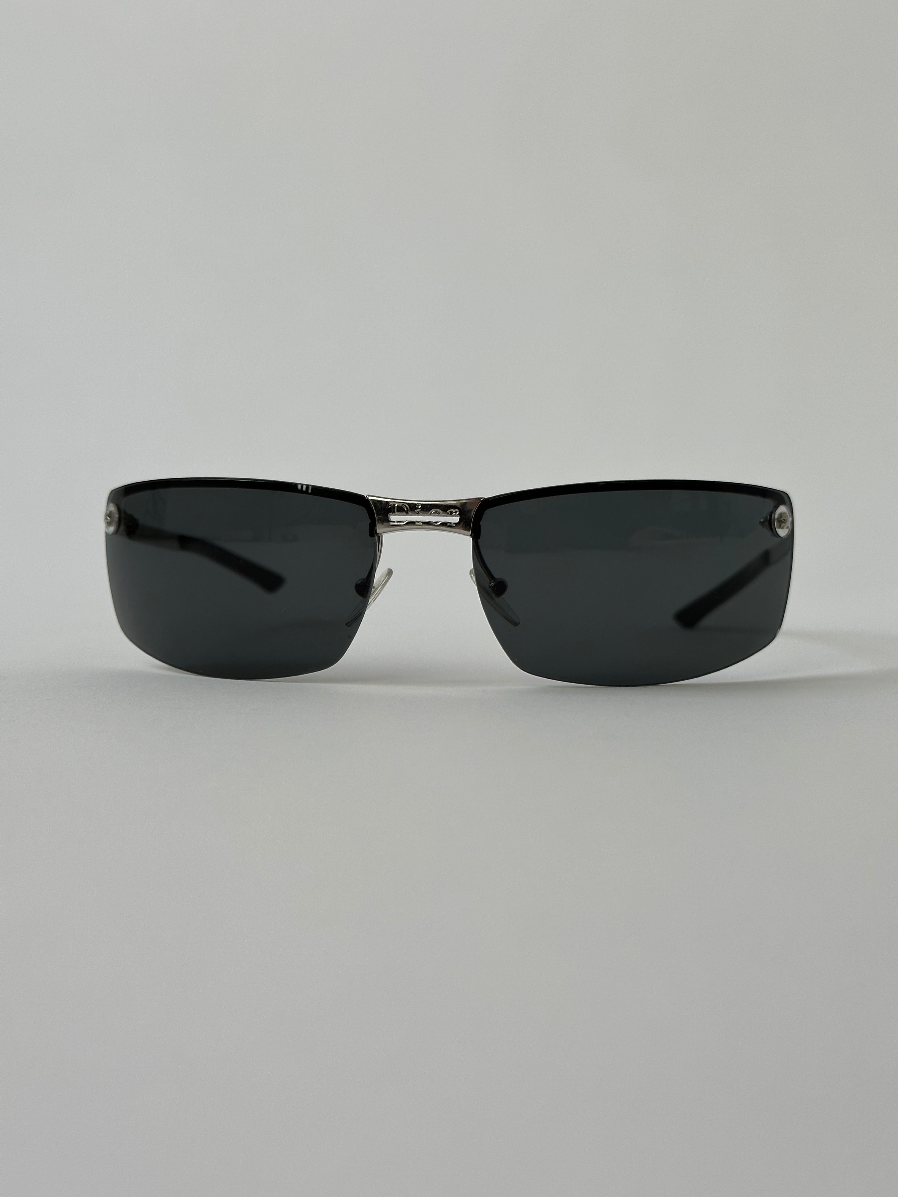 Christian Dior 2000s rimless sunglasses with sleek, minimalist design and tinted lenses, stylish eyewear accessory.