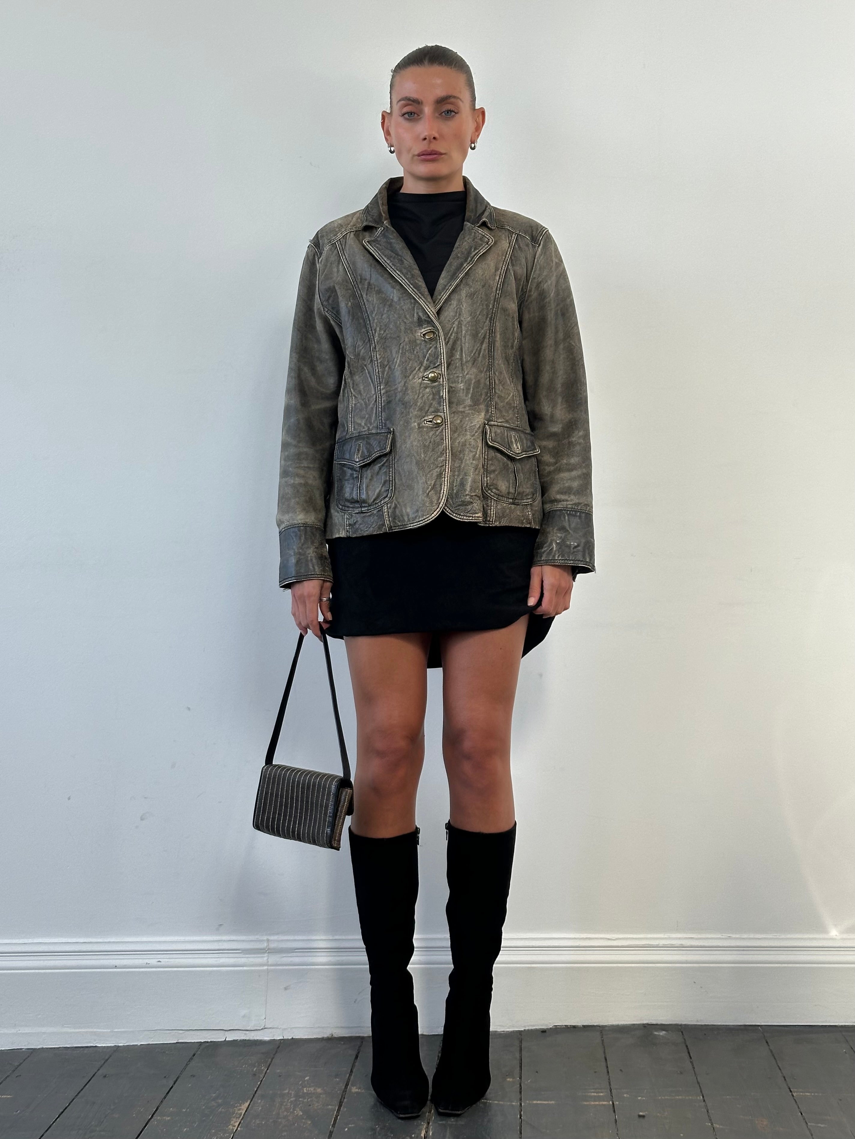 Vintage aged leather blazer jacket, size M, featuring classic design and distressed leather texture, perfect for a stylish look.