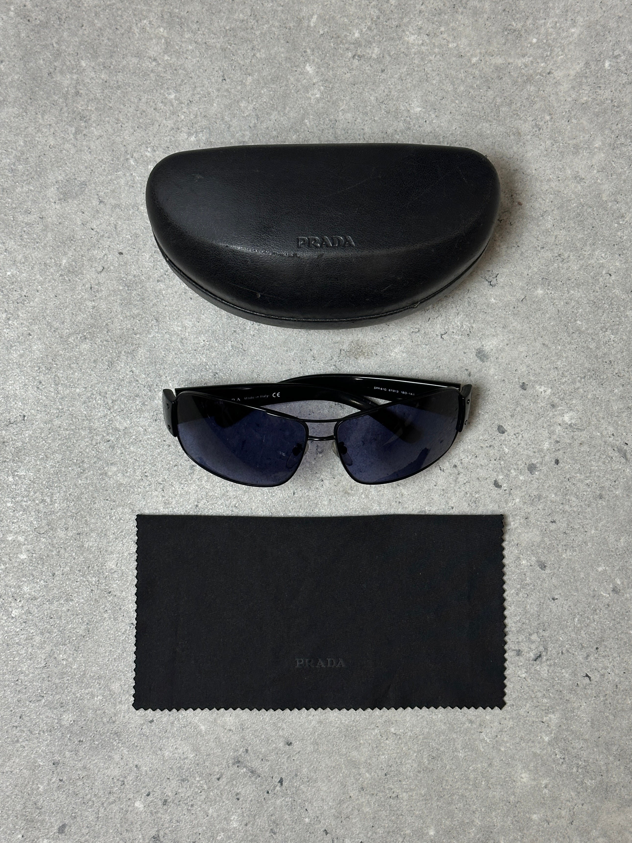 Prada aviator shield sunglasses with dark tinted lenses and metal frame, stylish eyewear for sun protection.