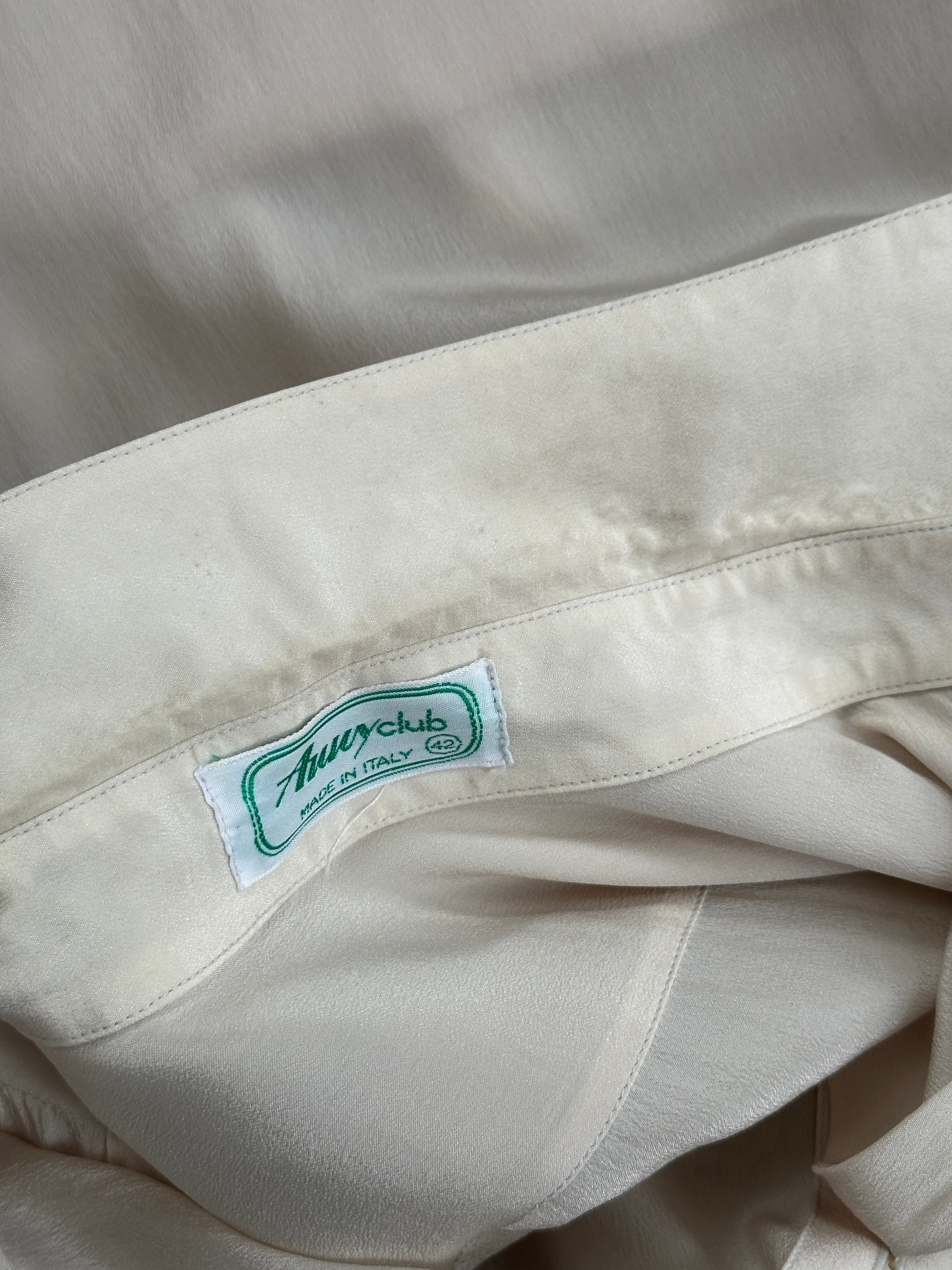 Vintage Italian silk pleated shirt with concealed placket, size M, featuring elegant design and soft fabric.