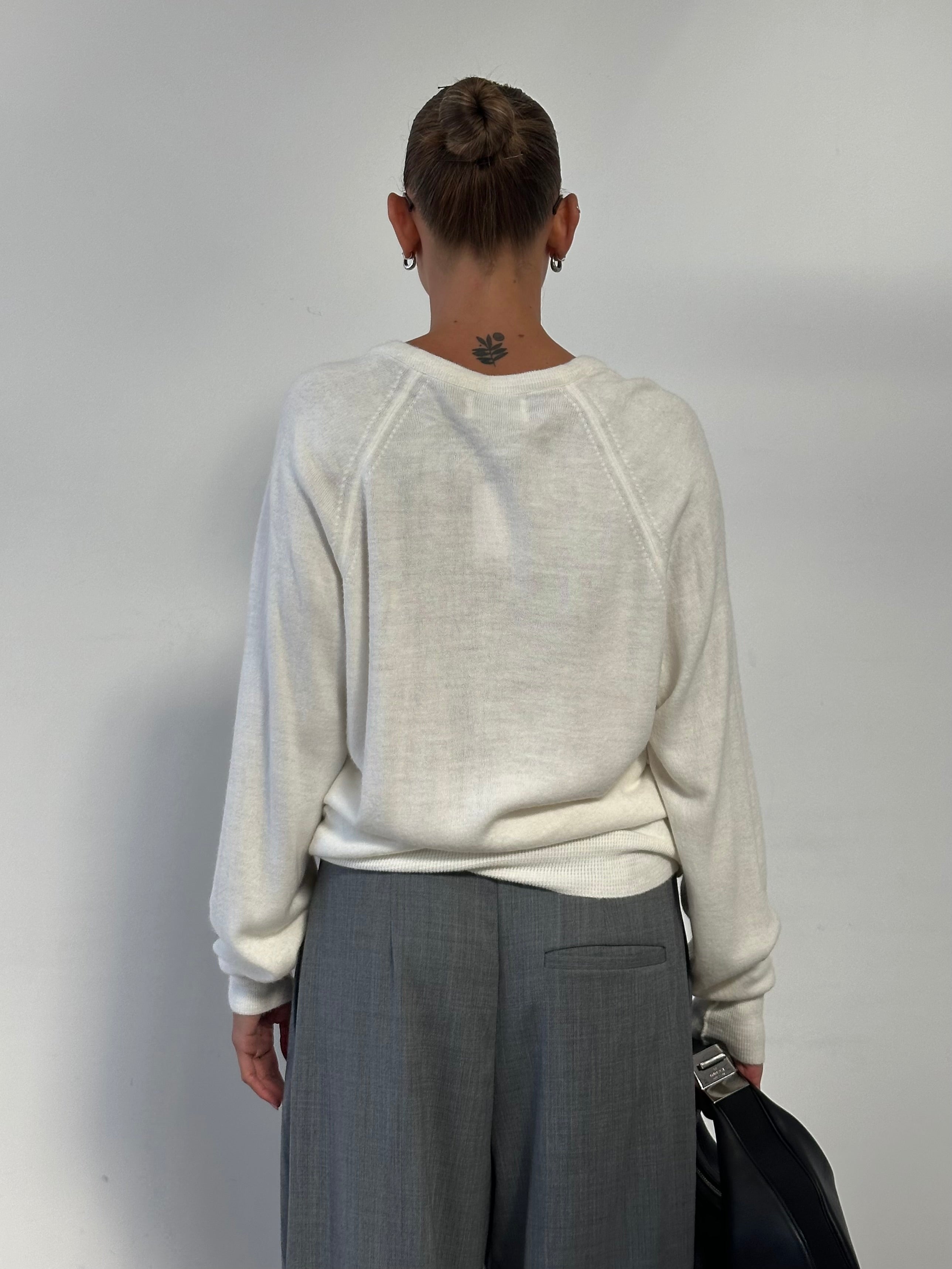 Christian Dior V-neck logo knitted jumper in size L, featuring a stylish design and textured knit fabric.