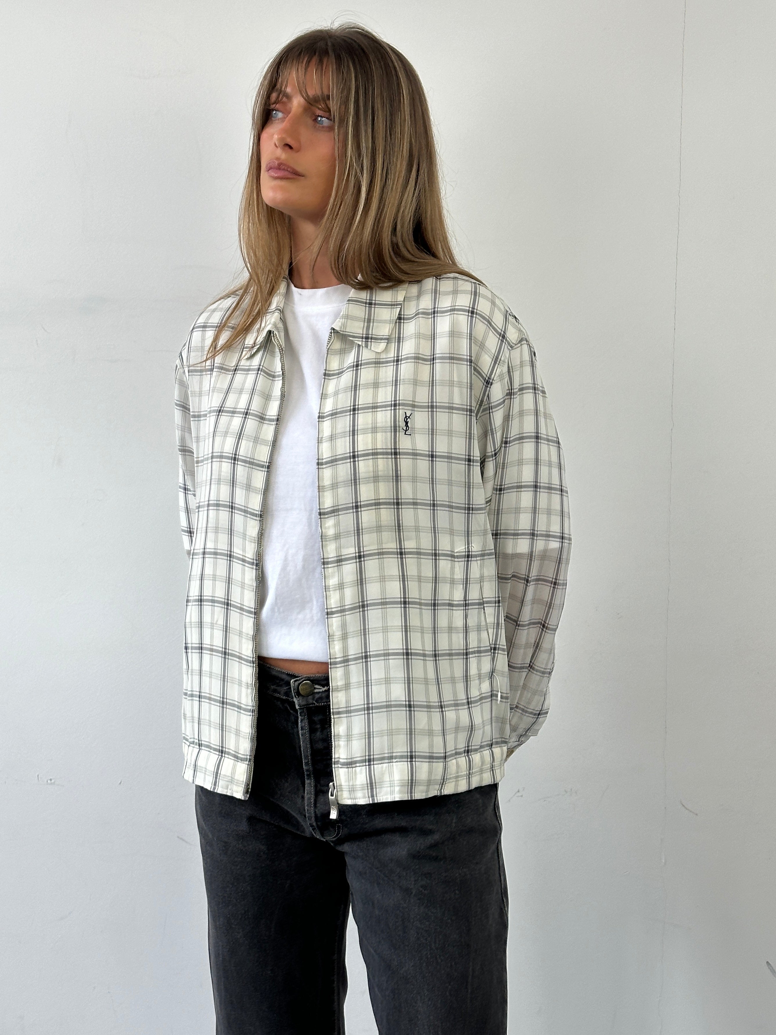 Yves Saint Laurent Pour Homme check logo bomber jacket in black with white check pattern, front zipper, and ribbed cuffs.
