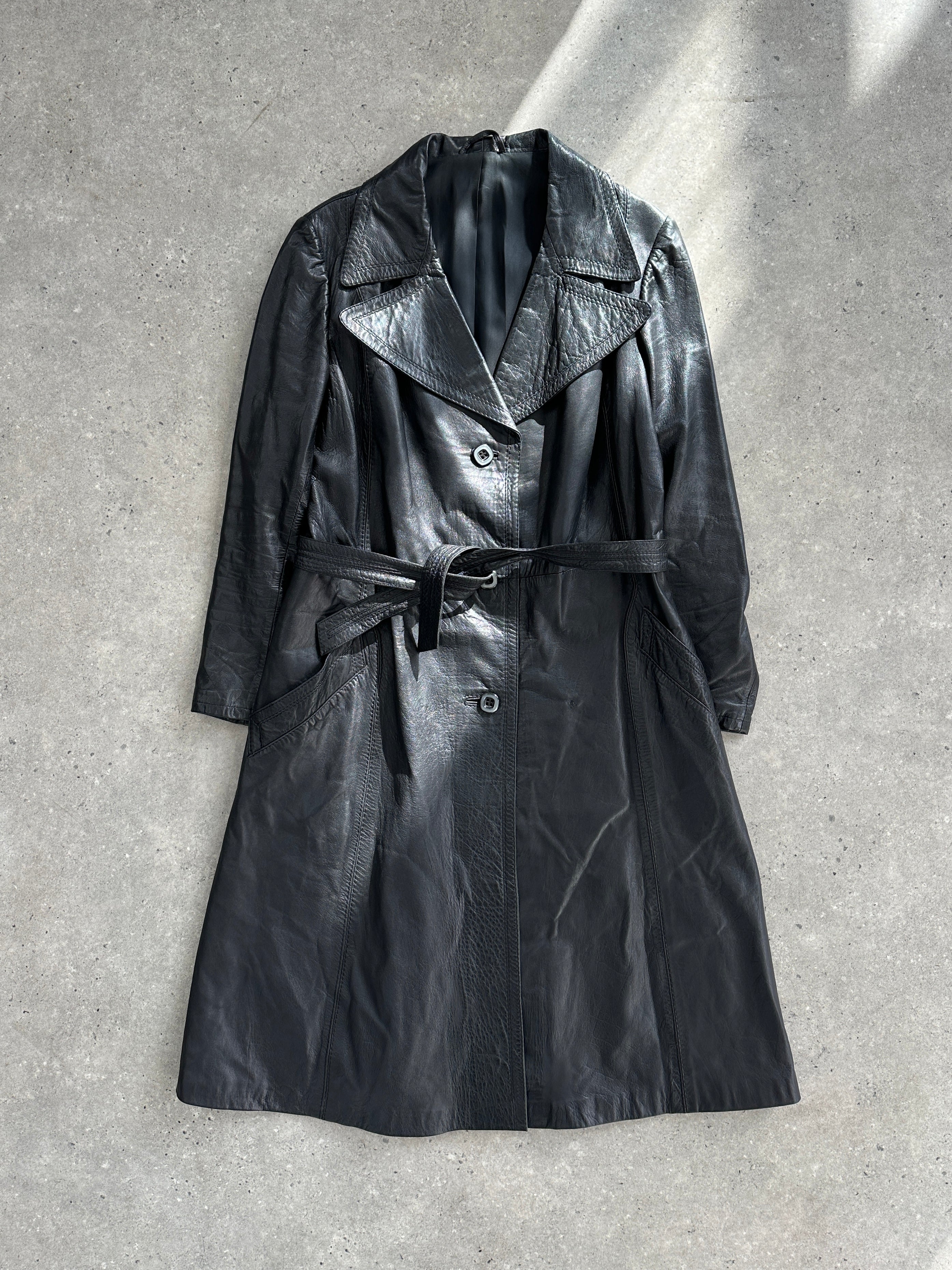 Vintage Italian leather trench coat with belted waist, stylish and classic design, size medium, featuring detailed leather craftsmanship.