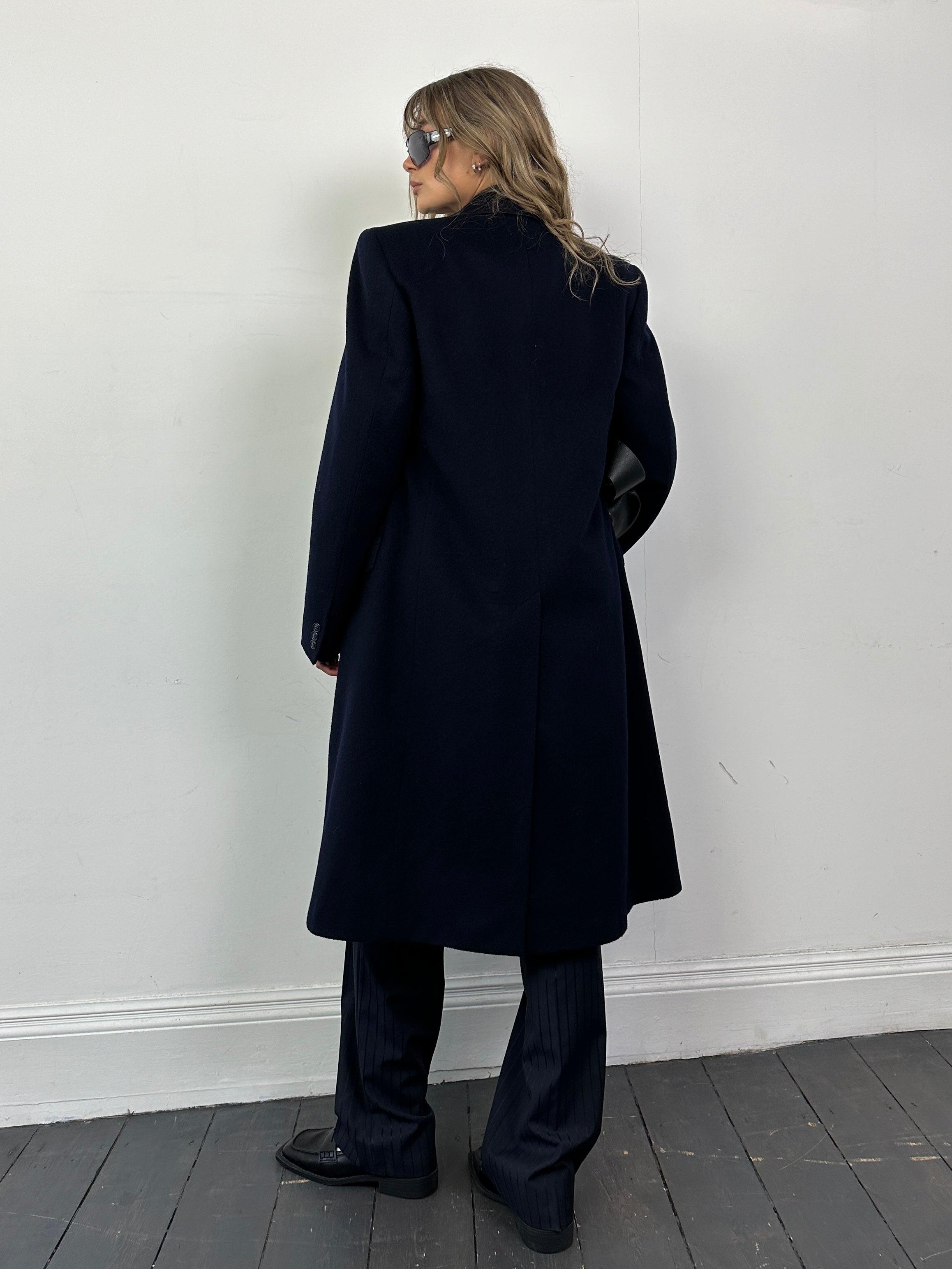 Vintage pure virgin wool double-breasted coat in size M/L, featuring classic tailored design and warm, textured fabric.