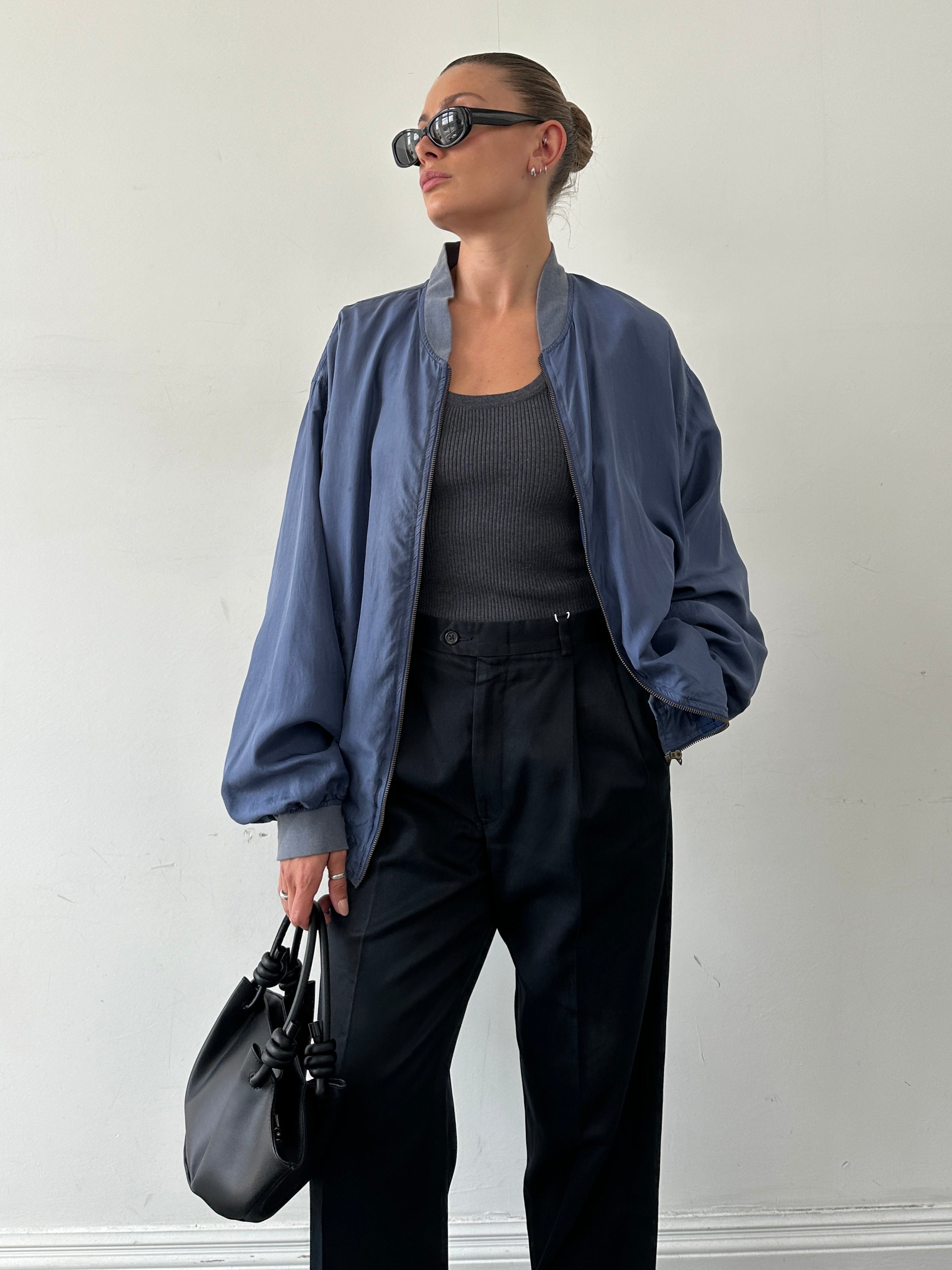 Vintage pure silk bomber jacket in XL, showcasing a sleek design with a smooth, shiny silk fabric and classic bomber style.