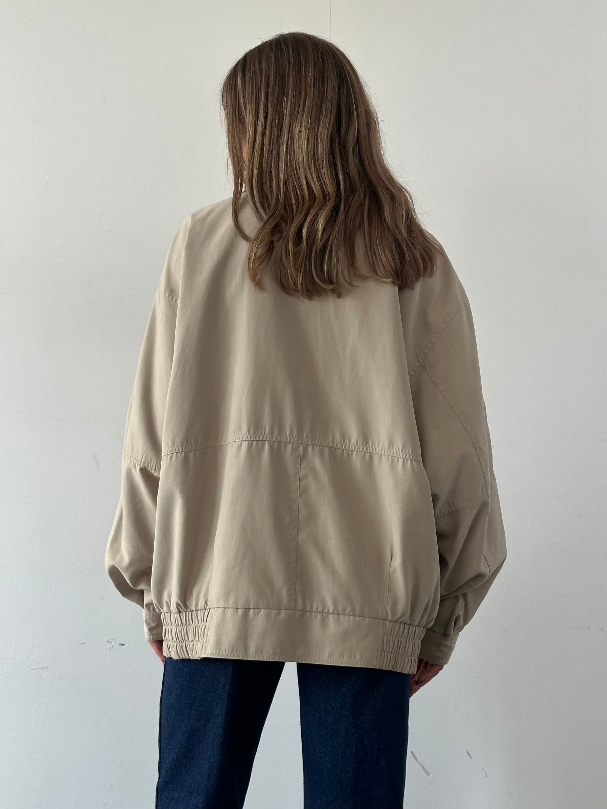 Vintage micro satin bomber jacket in XXL, showcasing a classic retro style with a smooth satin finish and ribbed cuffs.