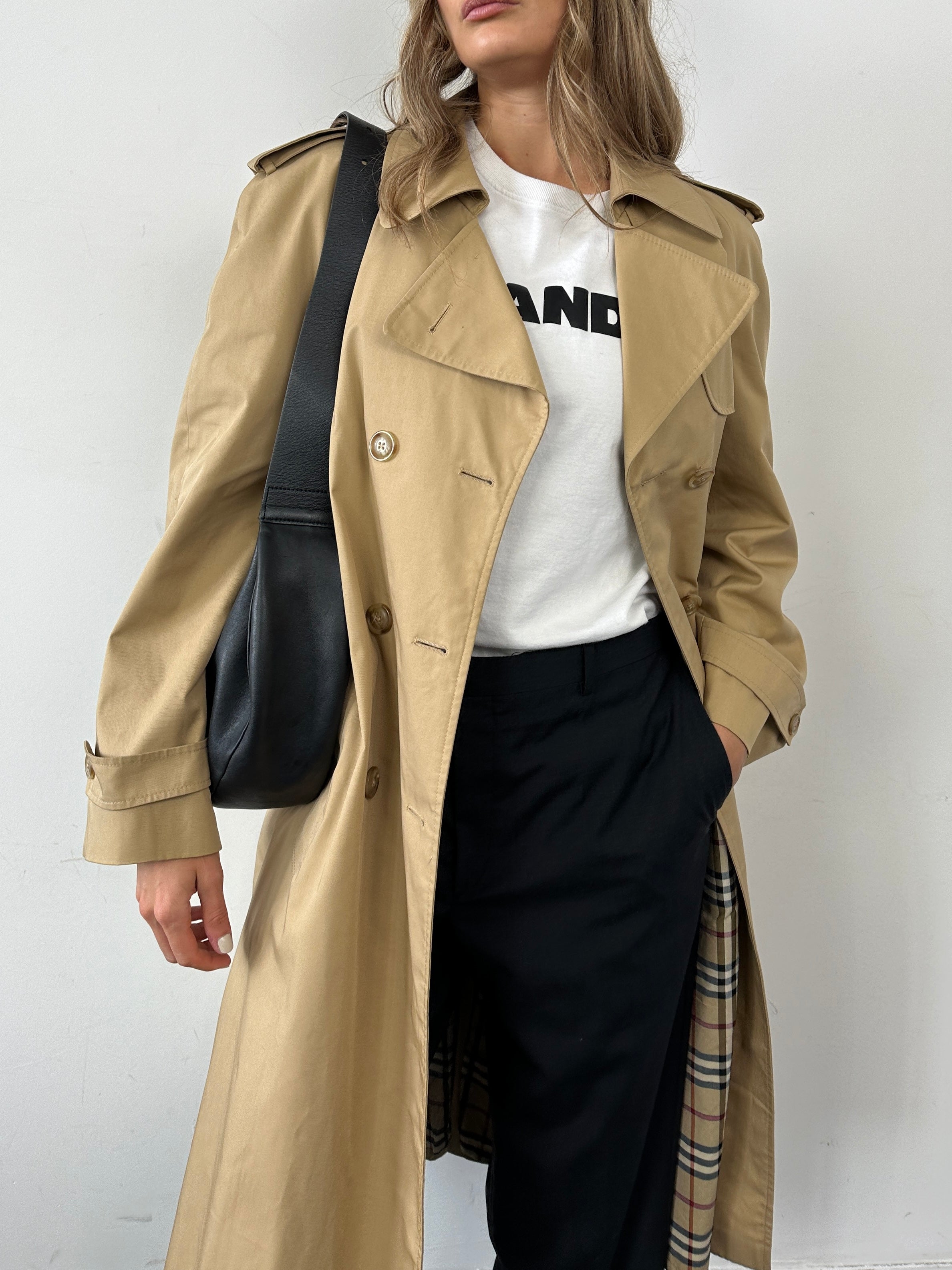 Vintage cotton double-breasted belted trench coat in size L, featuring classic style and timeless design.