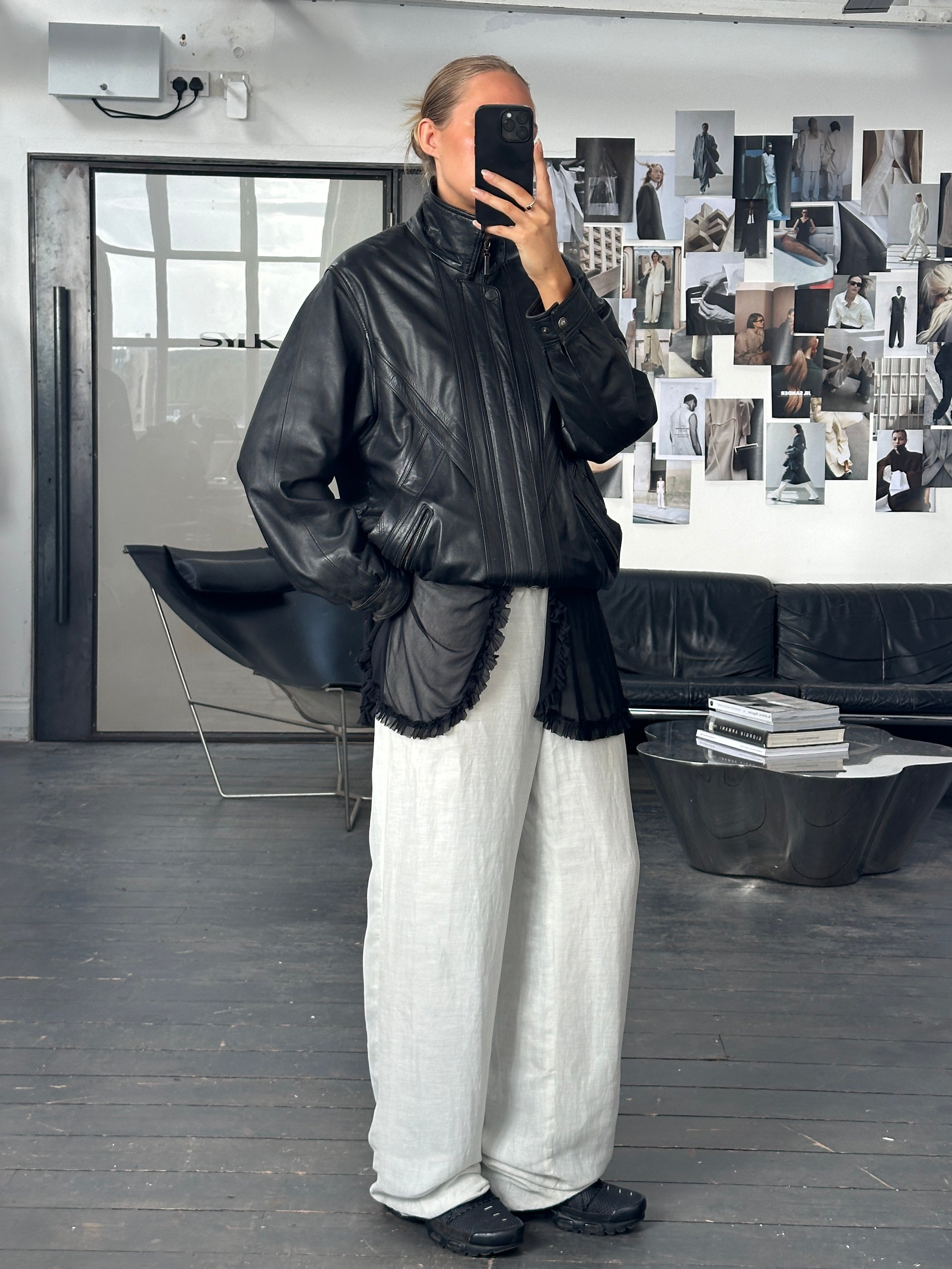 Vintage 1990s high neck leather bomber jacket in XL, featuring classic design and textured black leather.