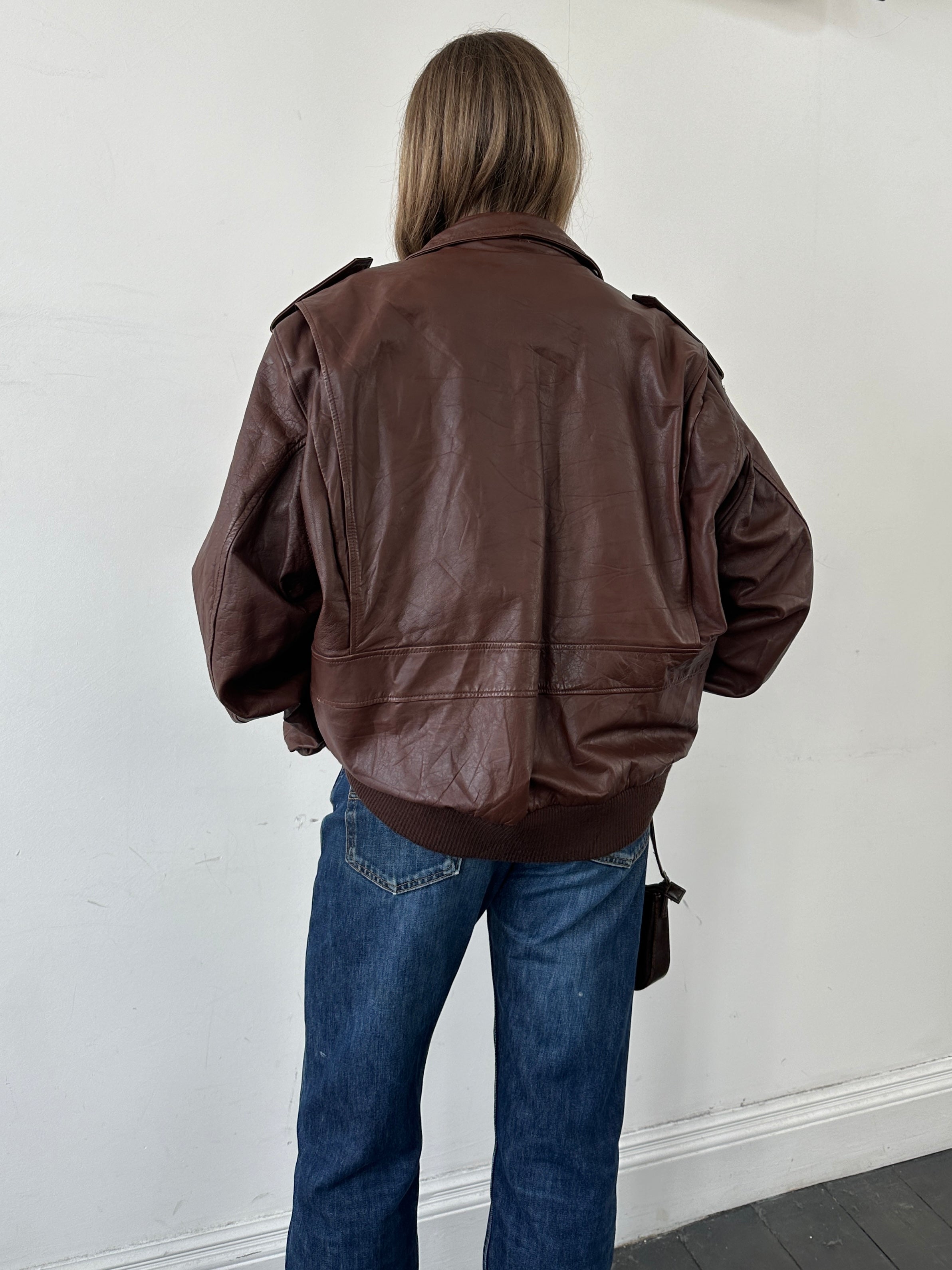 Vintage double zip leather bomber jacket in XL style, featuring classic design, high-quality leather, and double front zippers.