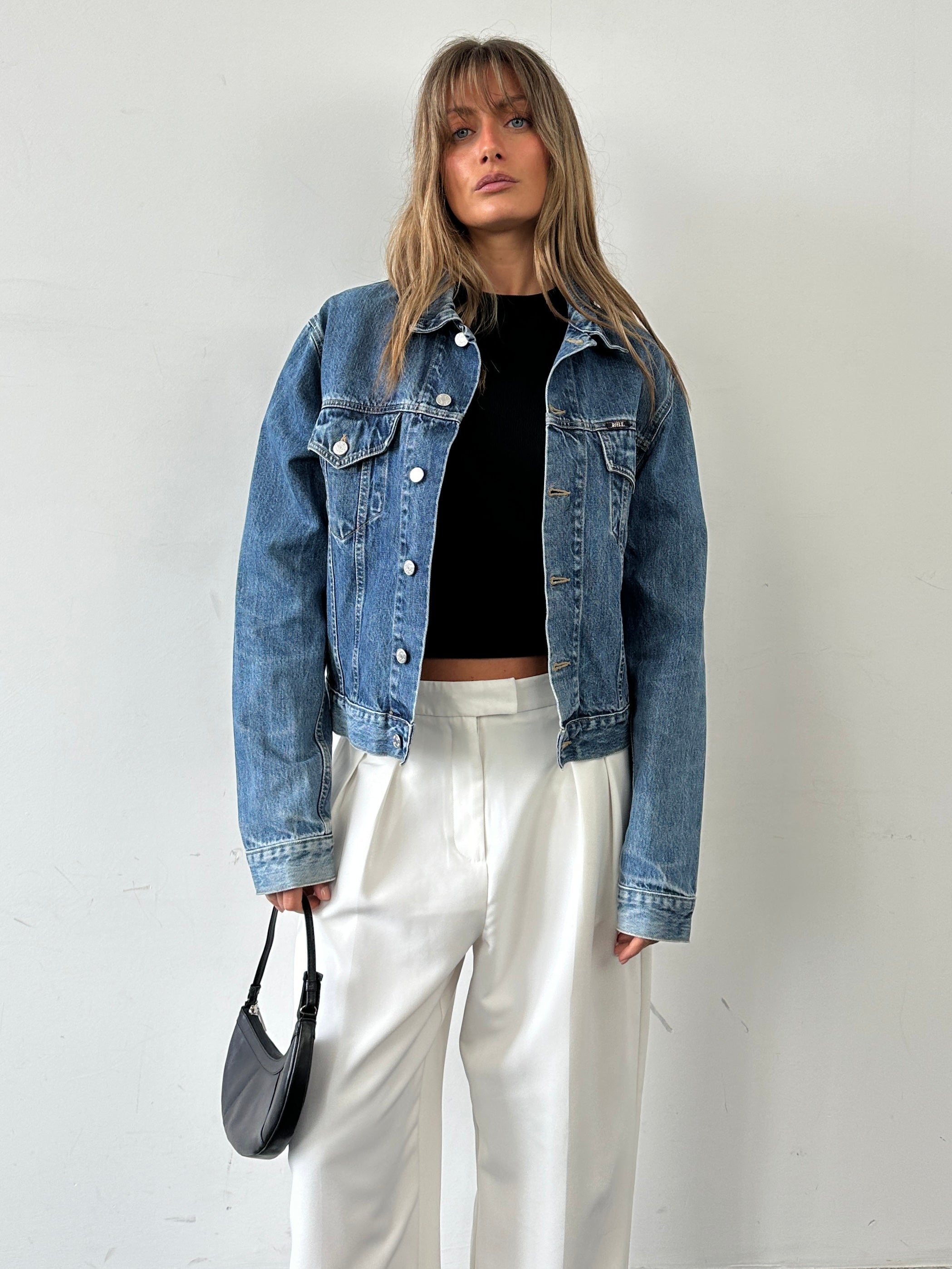 Vintage pure cotton denim jacket in size M, classic blue wash with button closure and chest pockets.
