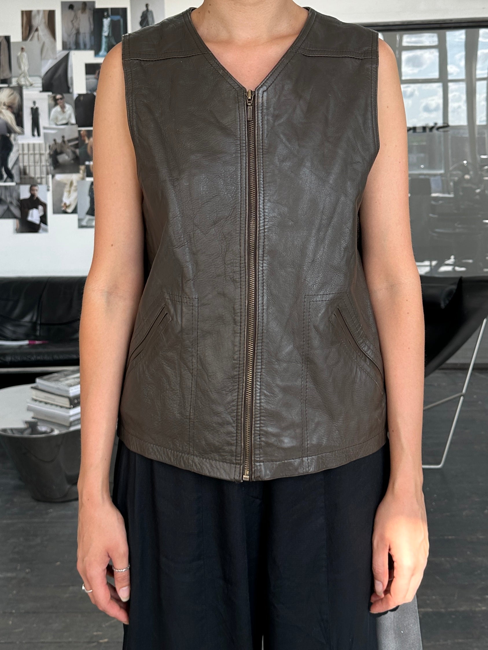 Vintage 1990s front zip leather waistcoat, size large, with classic design and authentic leather details.