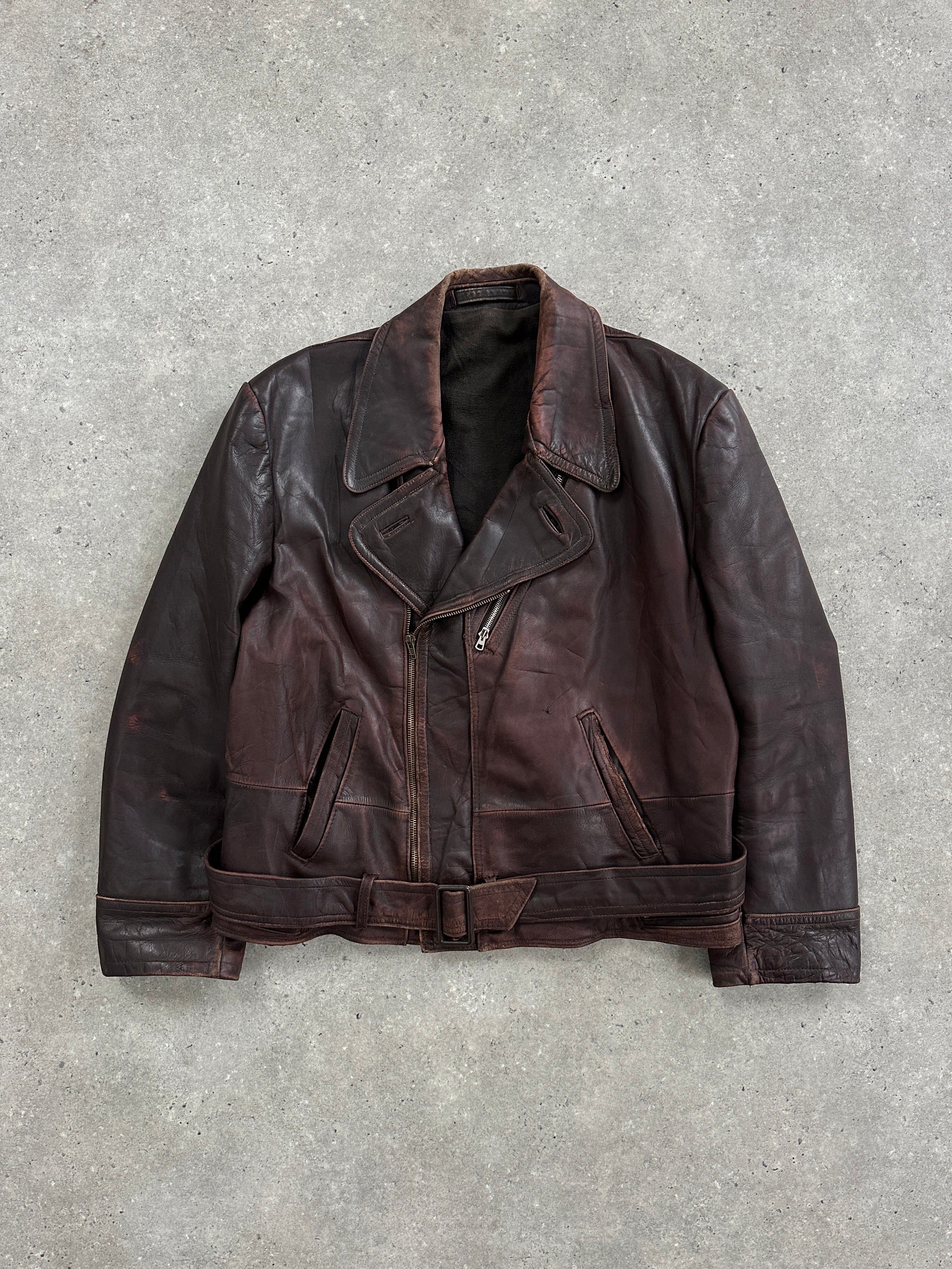 Vintage 1980s distressed leather biker jacket in large/extra-large size with rugged, worn-in style and classic motorcycle design.