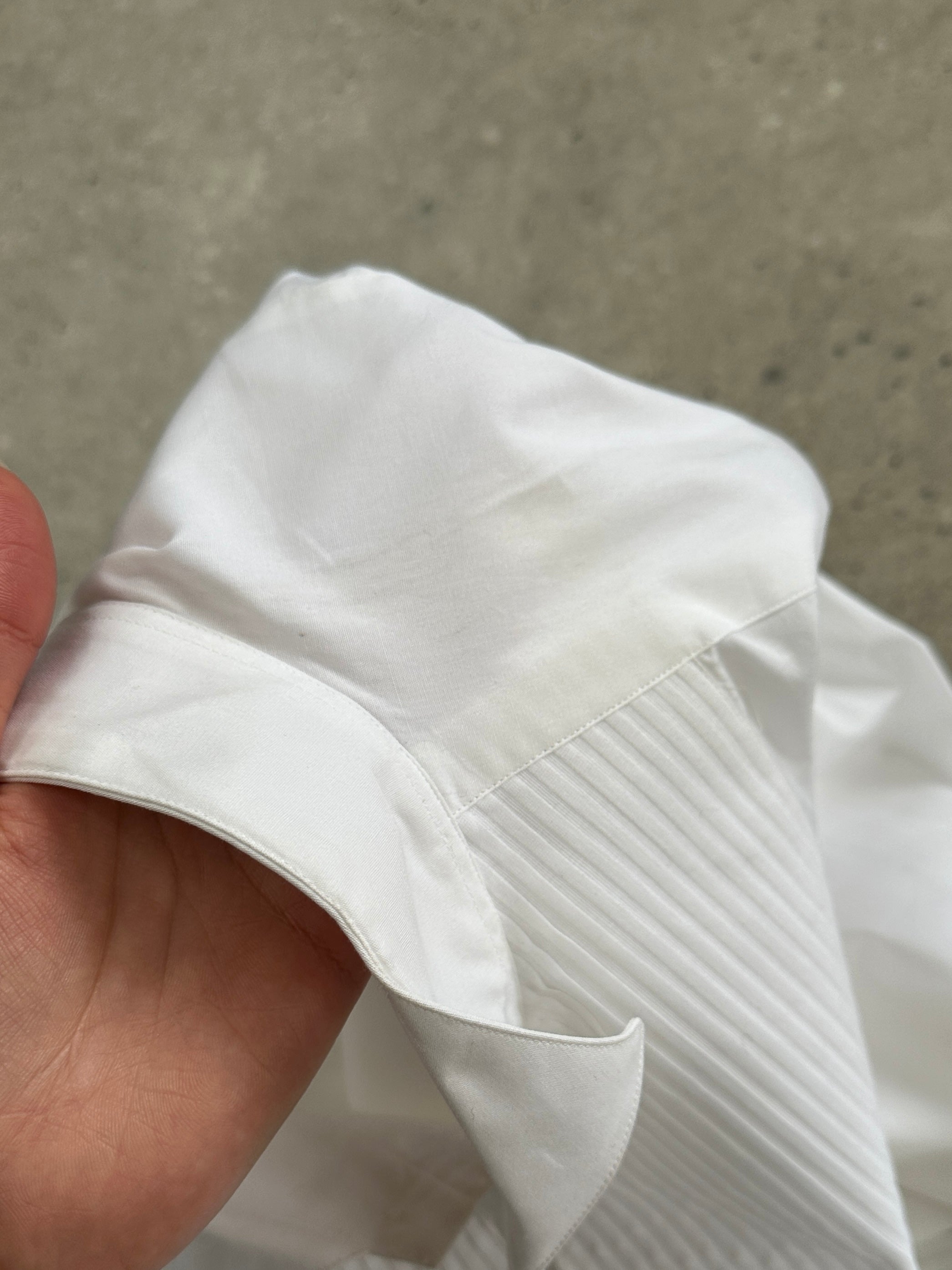 Vintage Italian vintage wing collar tuxedo shirt, size large, with crisp white fabric and classic formal design.