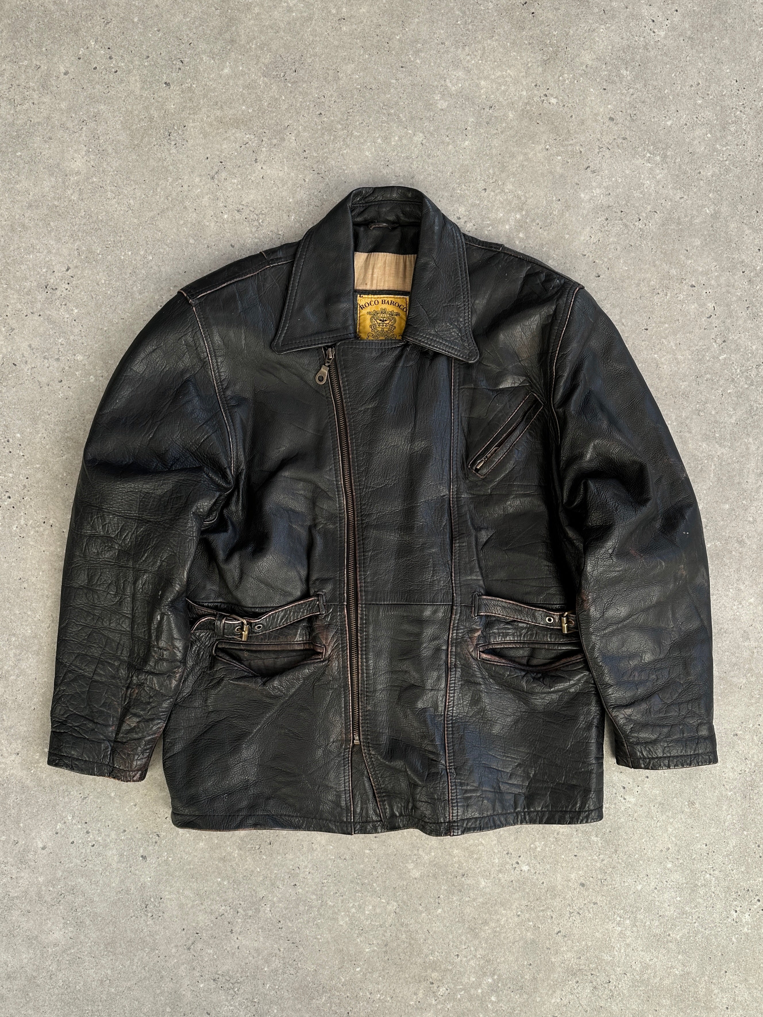 Vintage distressed leather jacket in XL size, featuring rugged design and classic style, shown on a hanger.
