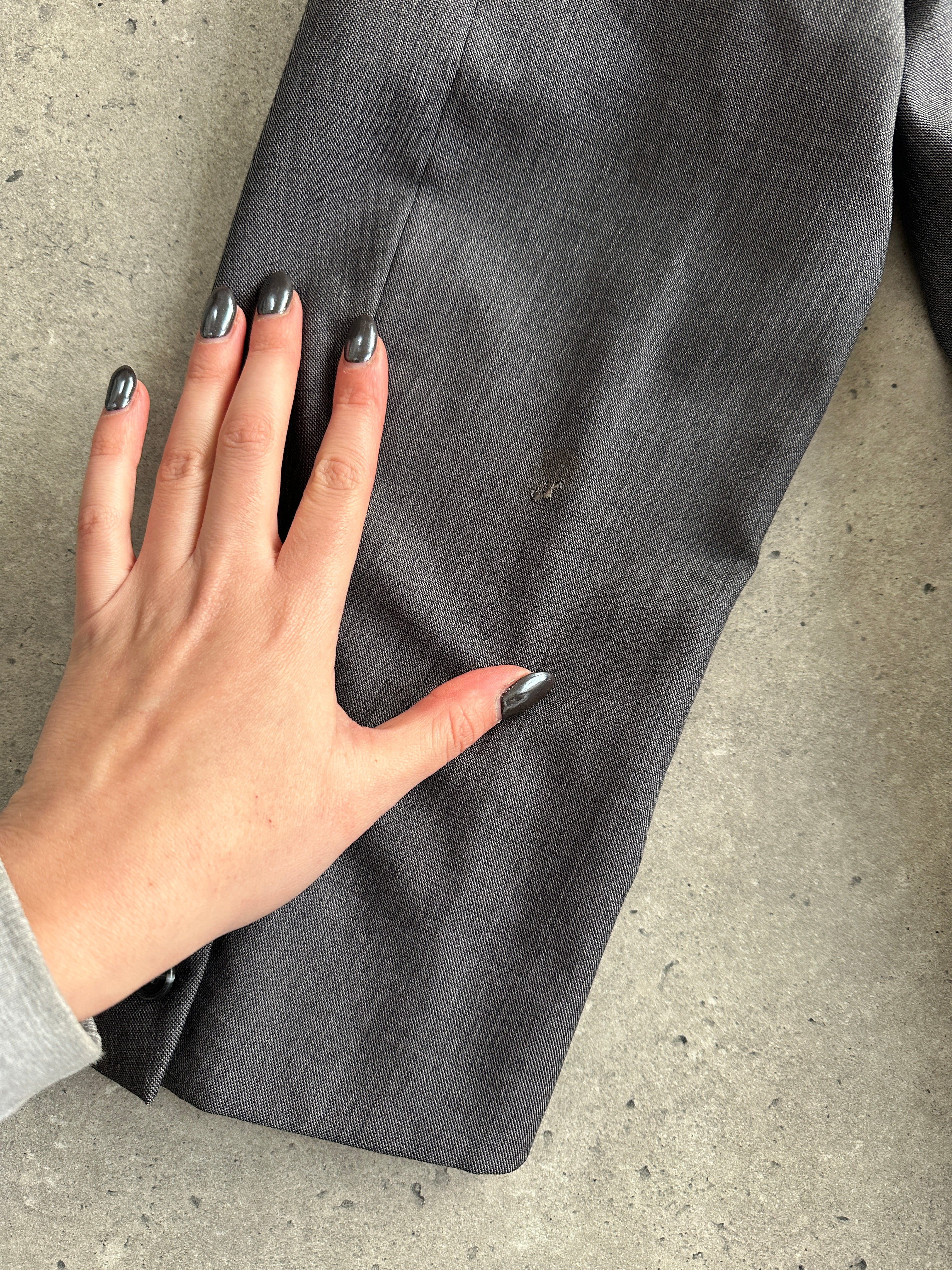 Christian Dior wool double-breasted jumpsuit in size 44S/W34, tailored with lapels and front buttons, elegant and sophisticated.
