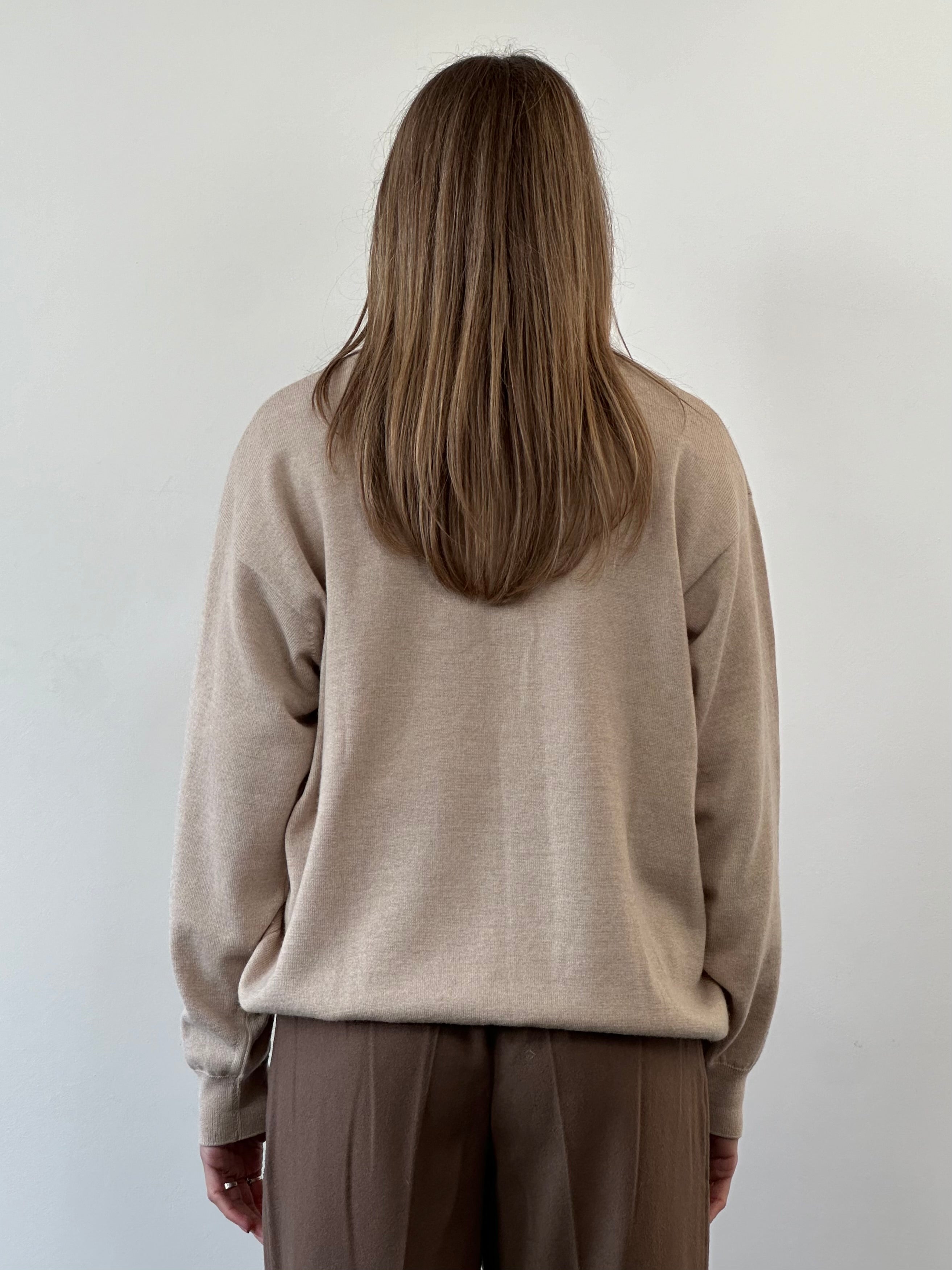 Burberry London Merino wool knitted jumper in size L/XL, featuring the iconic logo and classic design, displayed on a neutral background.