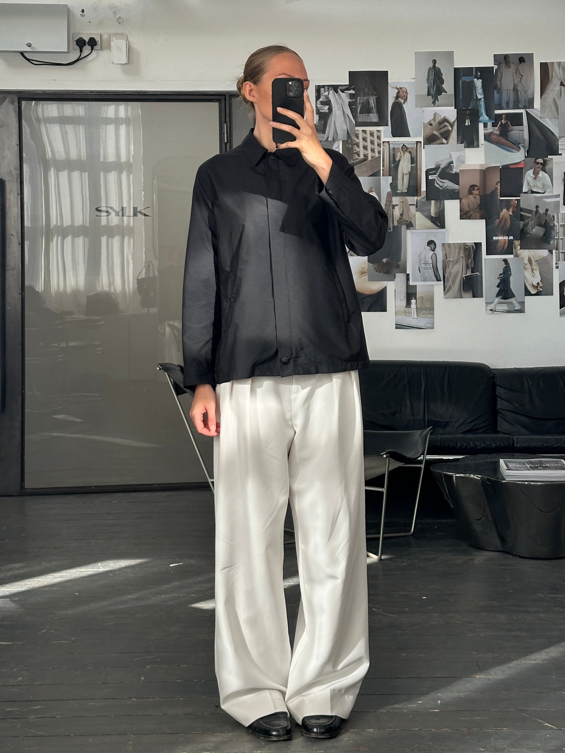 Max Mara Weekend 2000s bomber jacket with concealed placket, black fabric, and ribbed cuffs, size M, casual and stylish design