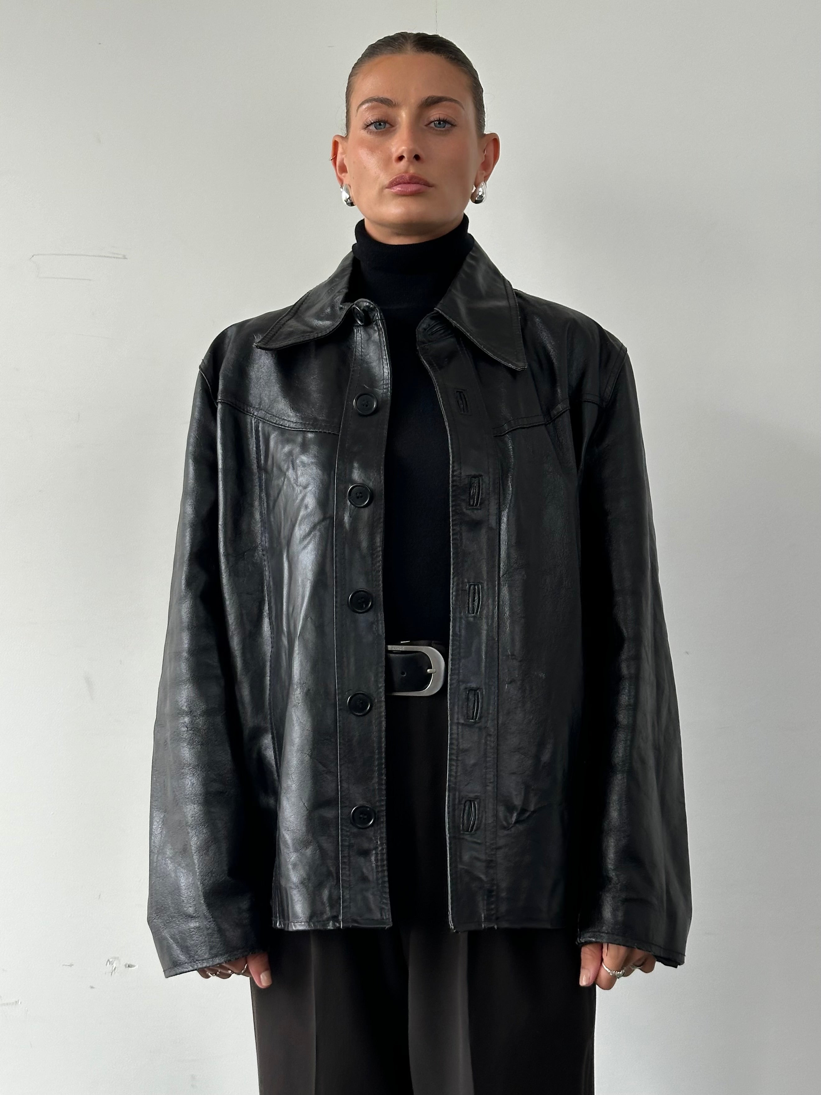Vintage Italian leather jacket with dagger collar, vintage style, in size large, features detailed stitching and classic design.