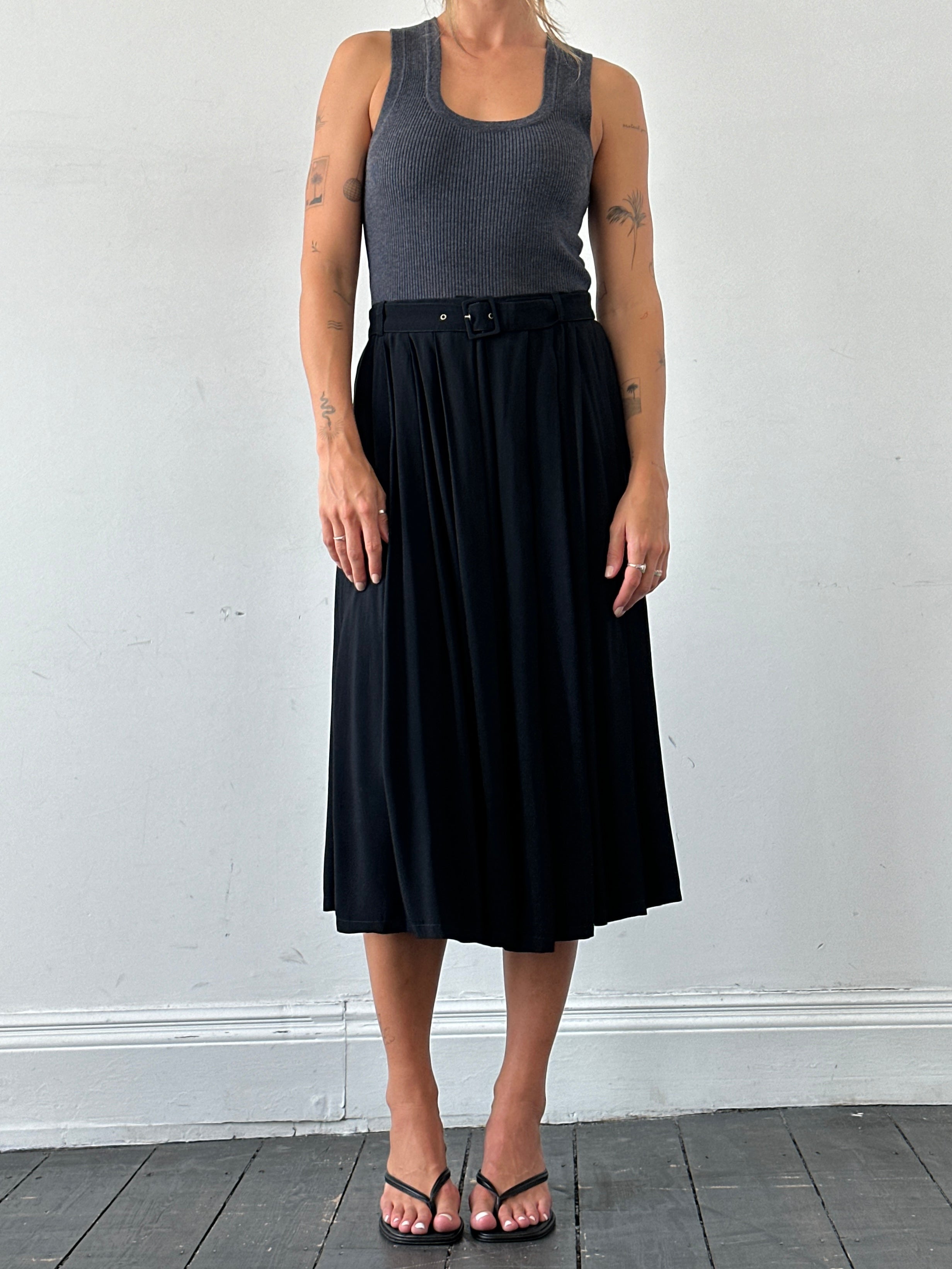 Iceberg pleated belted midi skirt in W28, featuring a flowing design with a waist belt and elegant pleats.