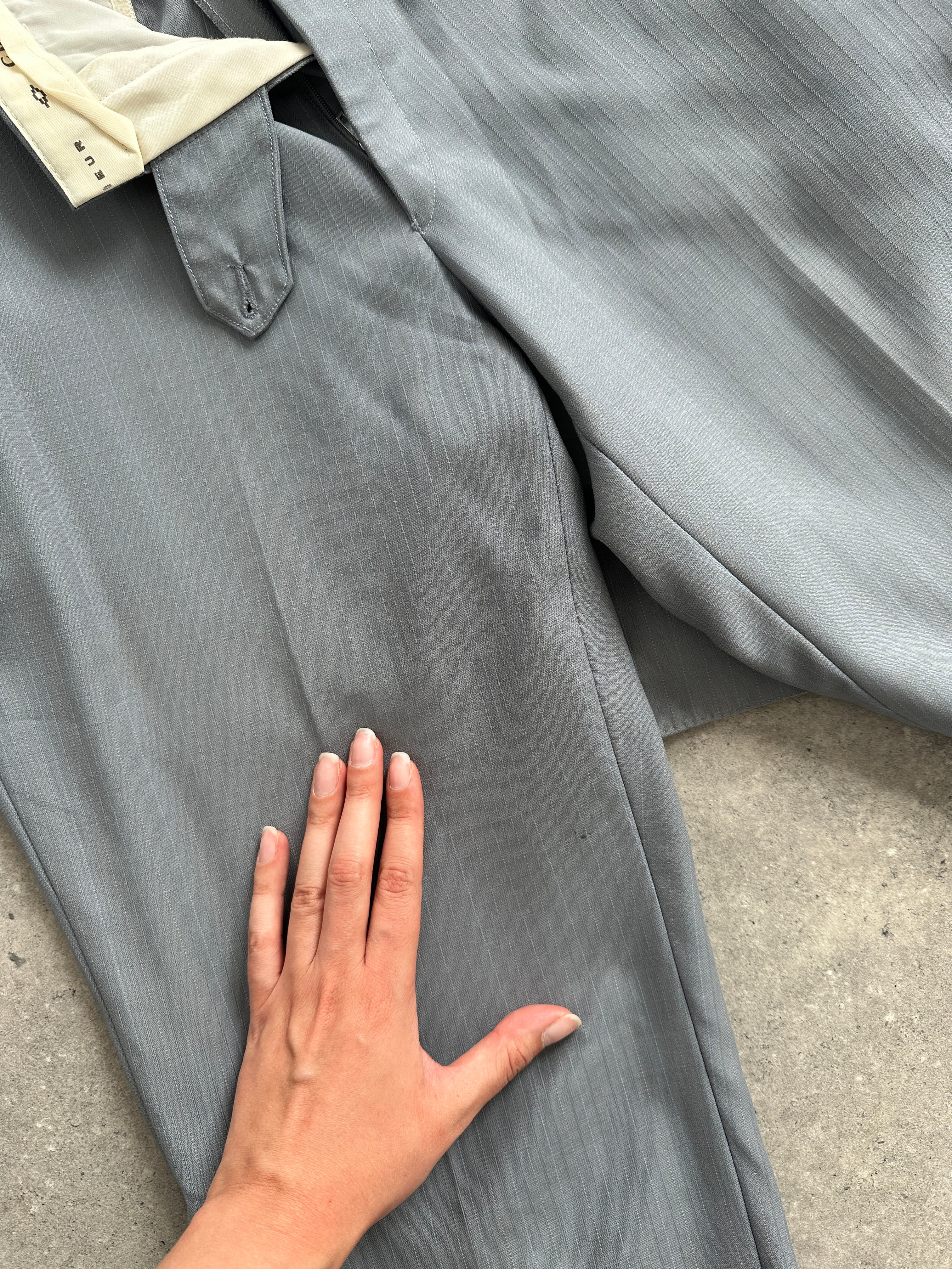 Christian Dior pure wool single-breasted suit jumpsuit in size 44R/W32, tailored fit, with lapel collar and classic design.