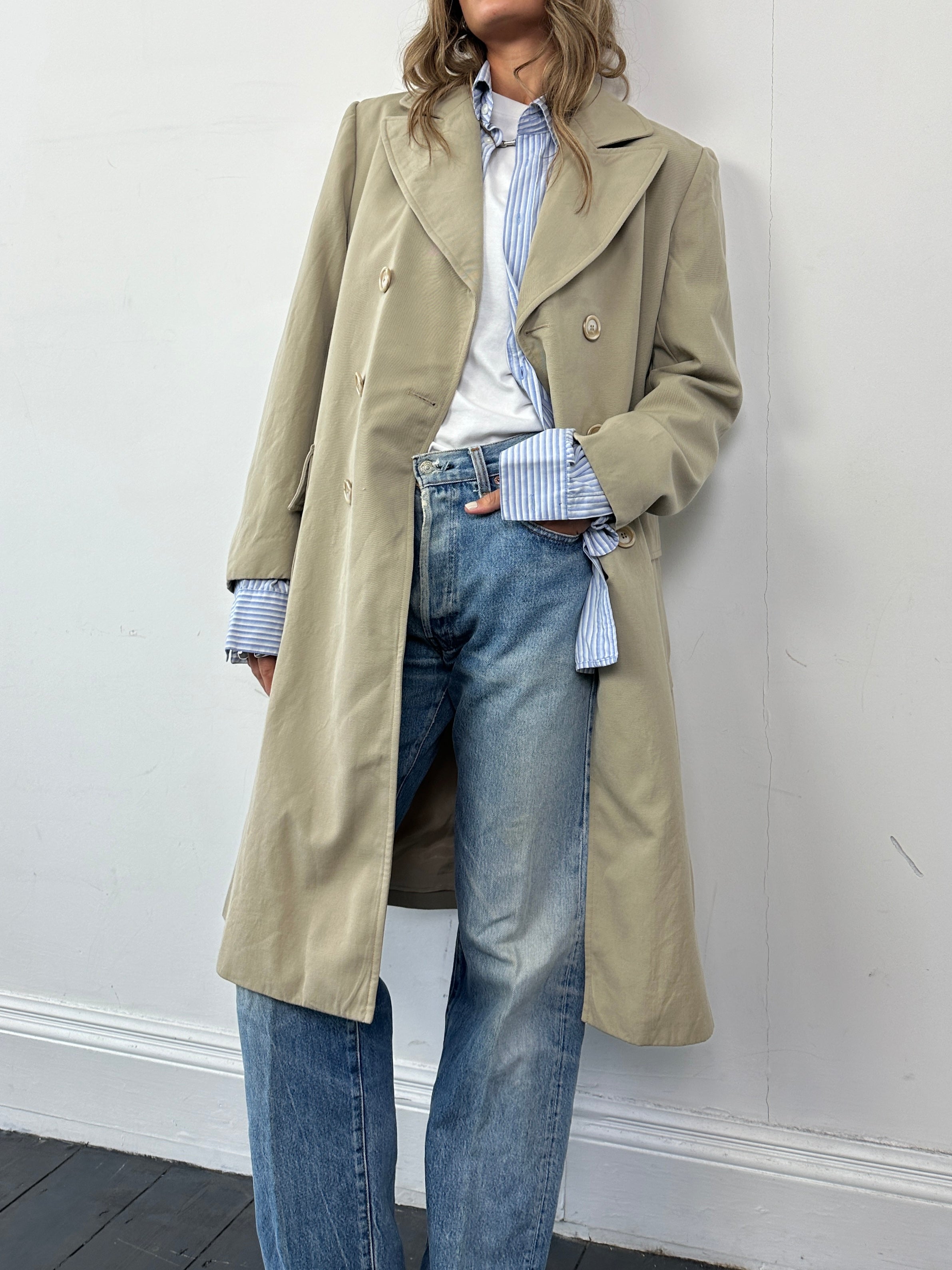 Vintage Italian double-breasted wool trench coat in classic style, featuring a tailored fit and vintage design details.