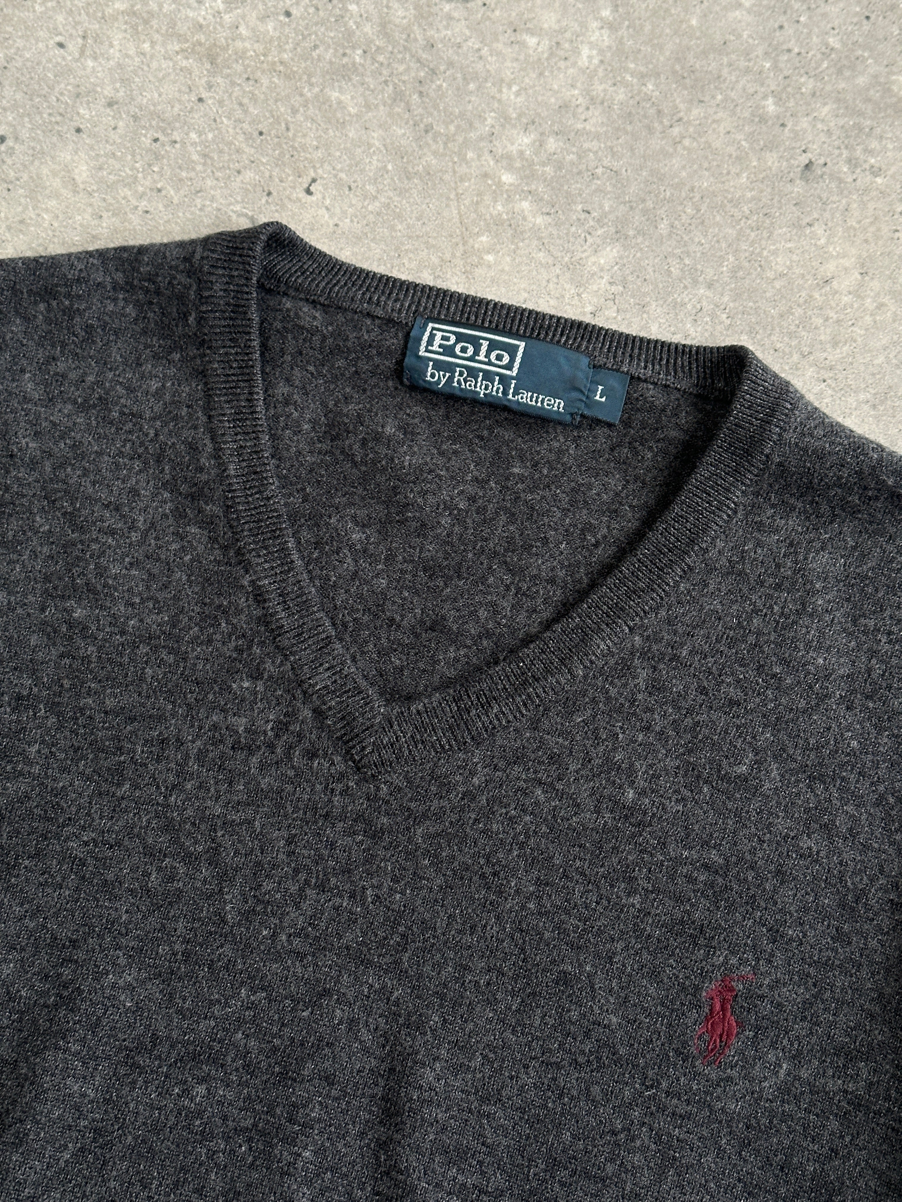 Ralph Lauren Pure Merino Wool V-Neck Jumper in size M, featuring the iconic logo and classic navy color, worn on a model.