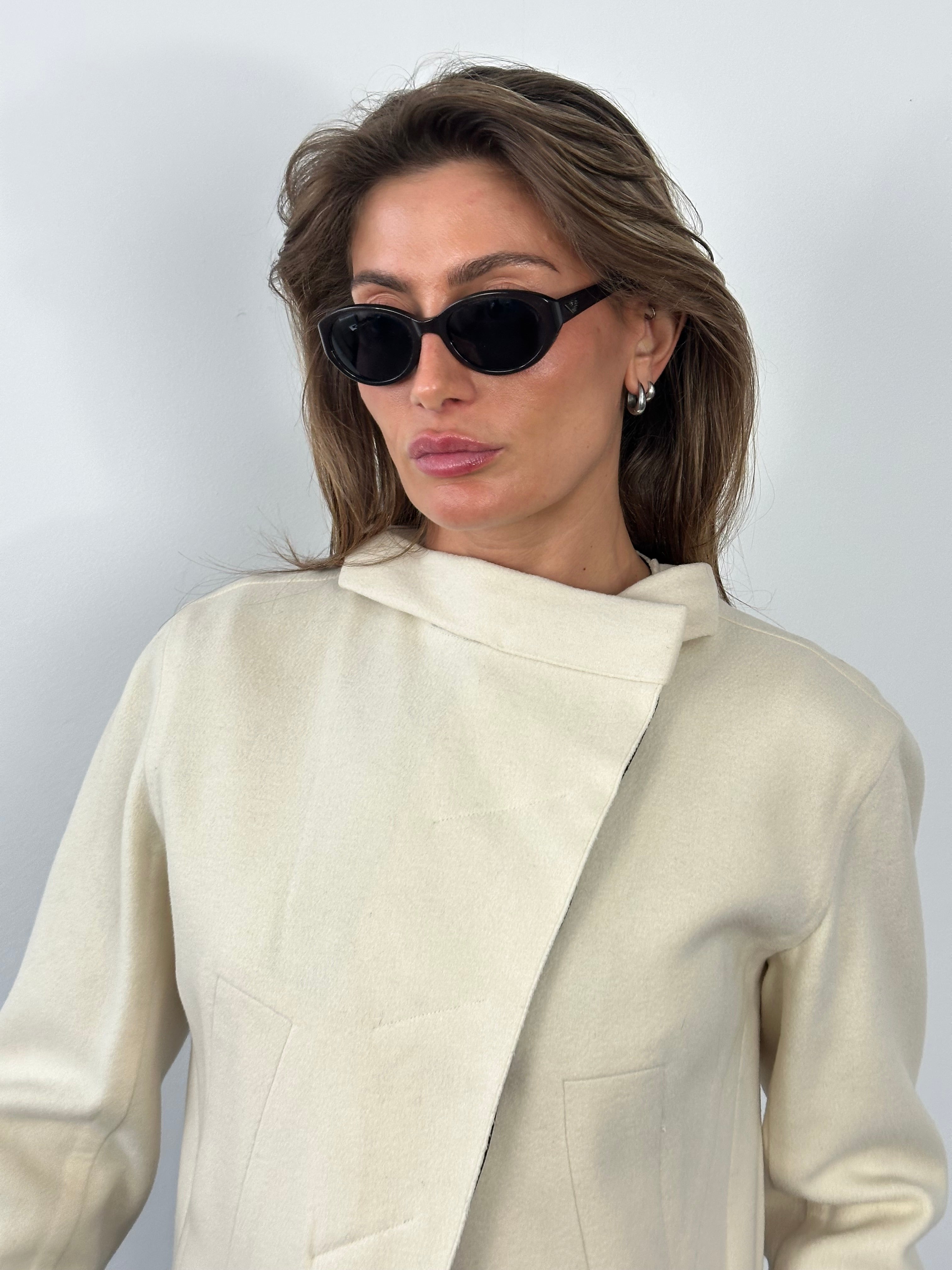 Donna Karan 2000s pure wool cropped jacket, front view showing tailored fit and classic design in neutral color.
