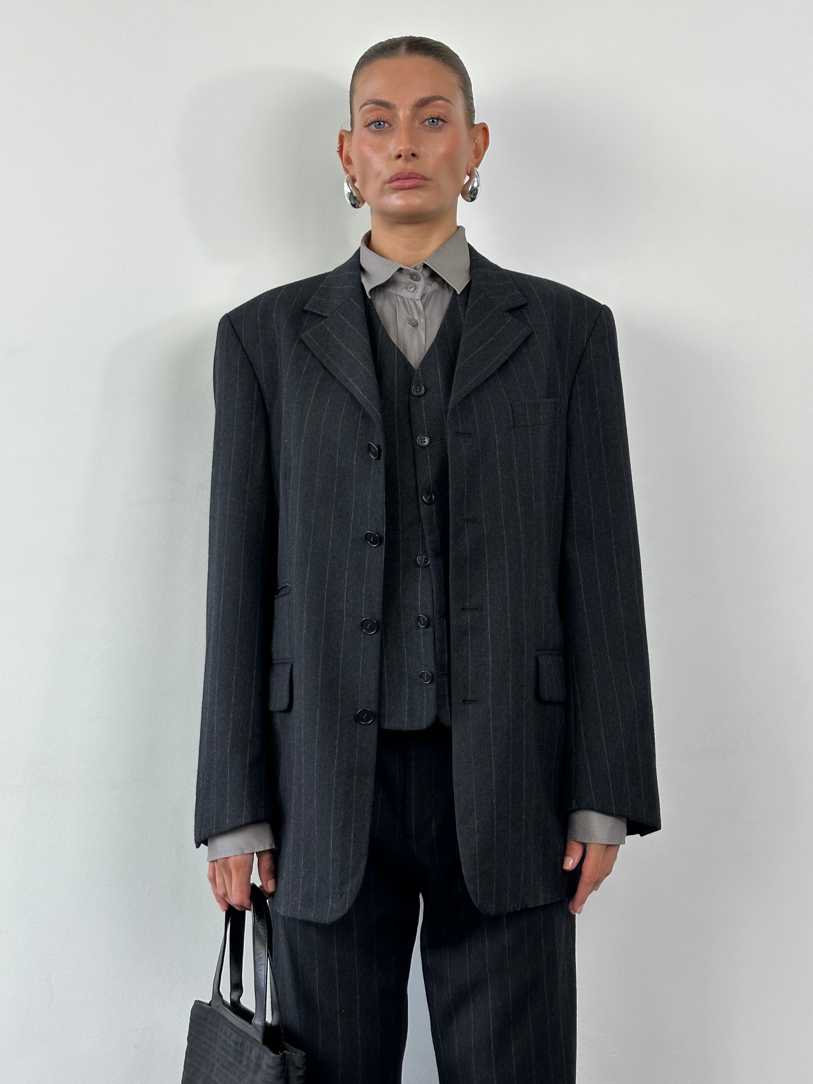 Yves Saint Laurent Pour Homme 1990s brushed wool pinstripe three-piece suit in size 40R/W30, tailored with a classic fit and lapel collar.