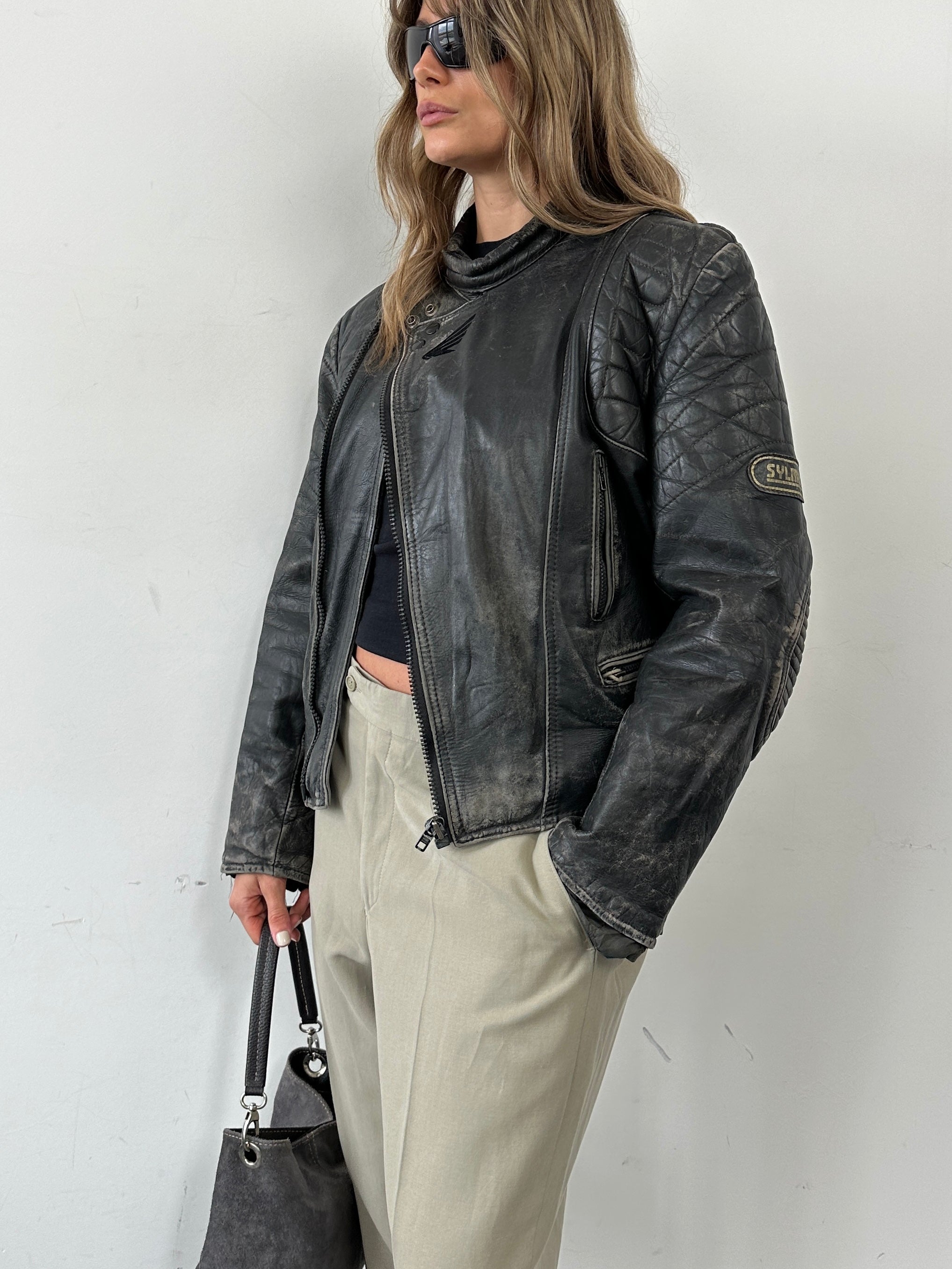Vintage Motorcycle distressed leather jacket in size M/L, featuring rugged leather and classic biker style.