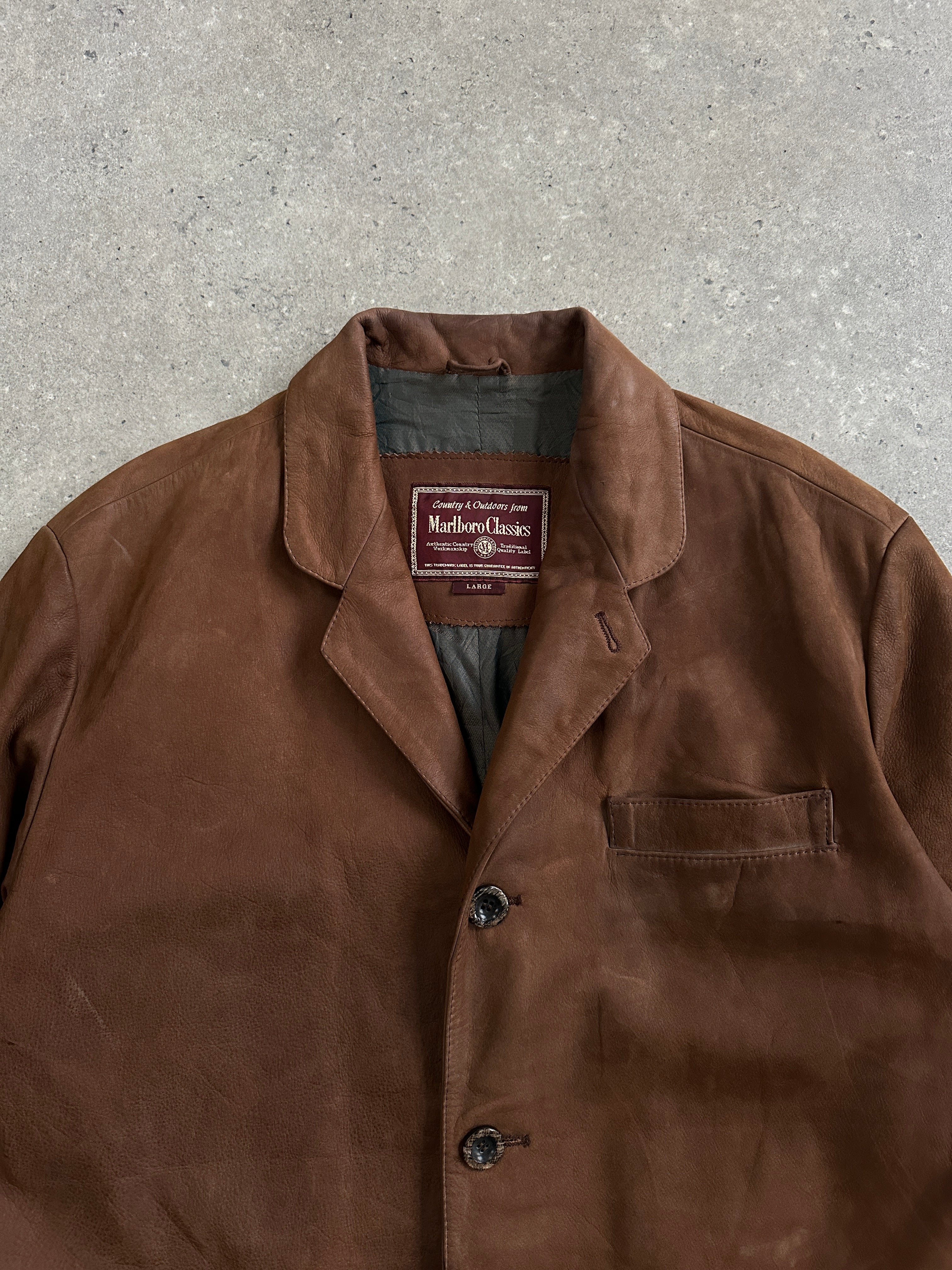 Marlboro Classics 1990s leather jacket in large/extra-large size, featuring classic brown leather with vintage detailing.