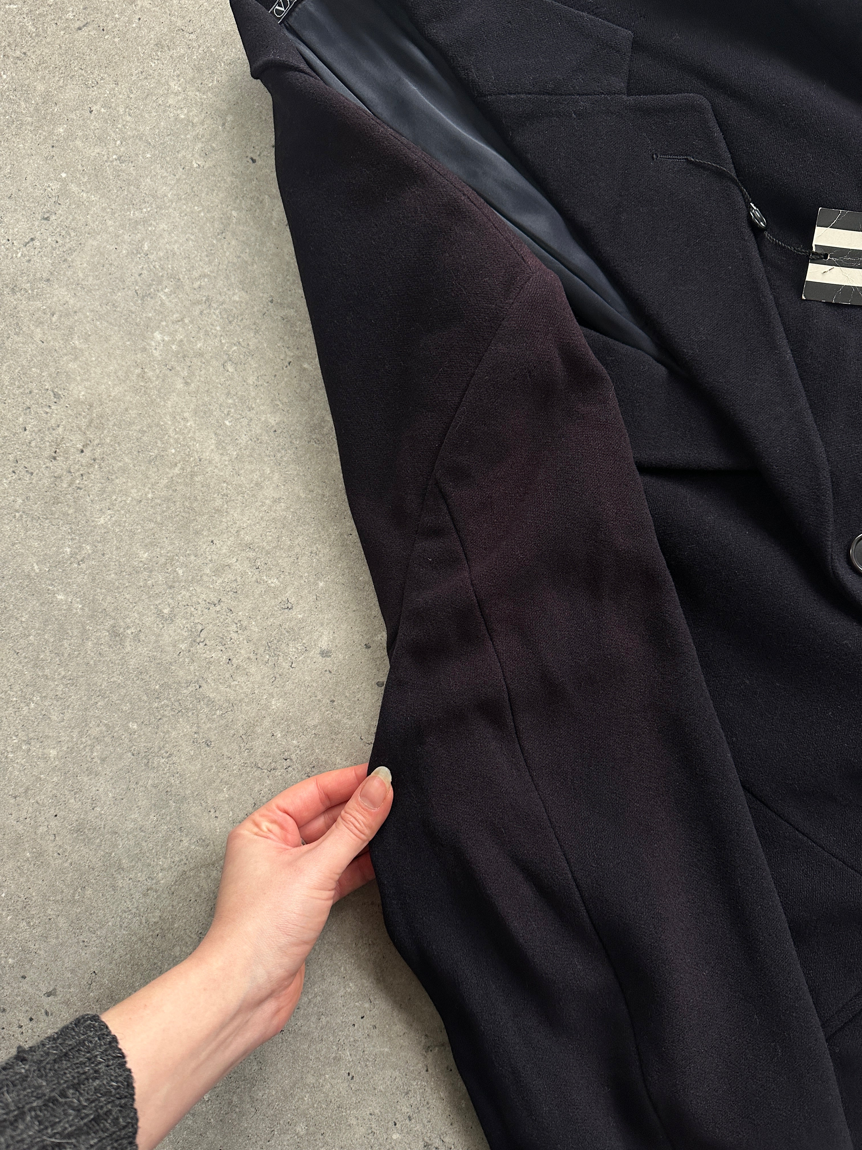 Valentino pure wool single-breasted coat in XL/XXL, displayed in a neutral setting, highlighting its tailored fit and classic design.