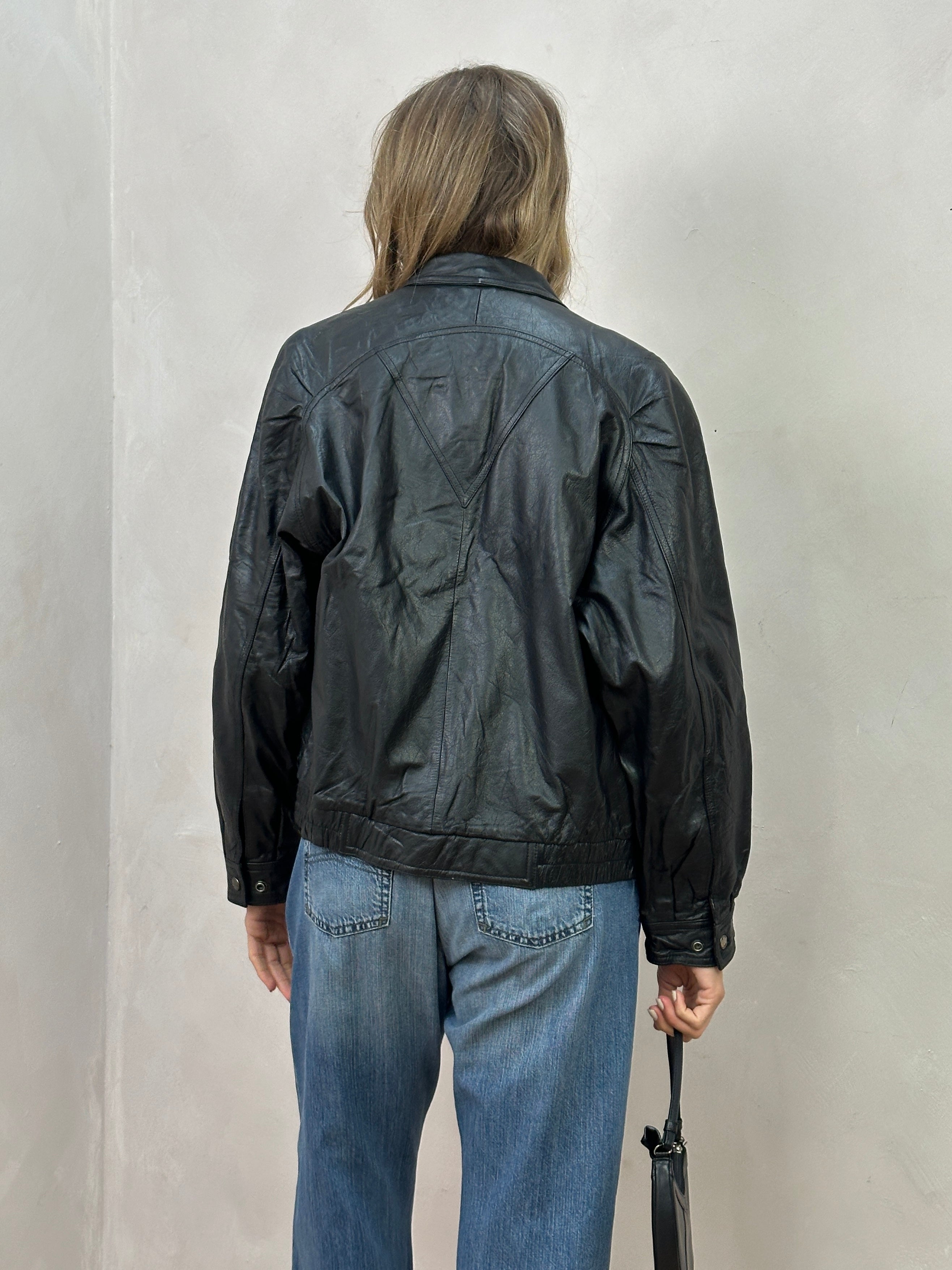 Vintage Leather Biker Jacket in size S/M with classic distressed design, featuring metal zippers and wide lapels.